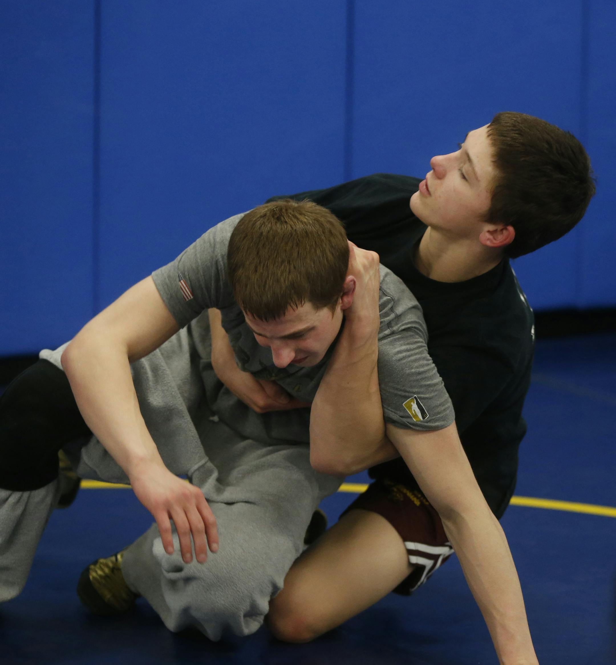 At St. Michael-Albertville H.S., 120 lbs Mitchell McKee,16, right, was showing off the crab hold on fellow wrestler Tommy Thorn. McKee's father, Steve, has been battling terminal cancer and hopes to see his son win the state title in St. Paul. ]richard tsong-taatarii/rtsong-taatarii@startribune.com