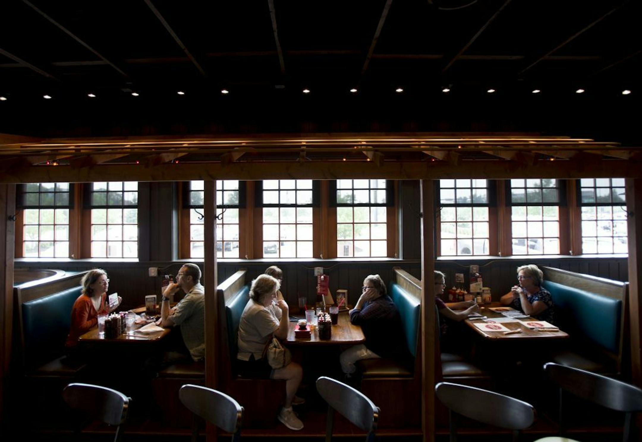 Lunch patrons sit in the bar area of Famous Dave's in Coon Rapids to enjoy a meal off their new menu.