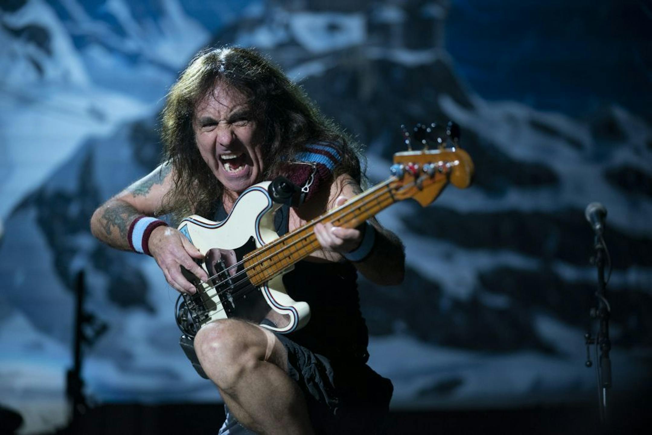 Iron Maiden bassist Steve Harris shot notes out to the crowd during "Where Eagles Dare" early in Monday night's set at the Xcel Center in St. Paul.
