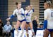 Wayzata twins Olivia Swenson (13) and Stella Swenson (10) jump up and tap hips in celebration during a game against Hopkins.