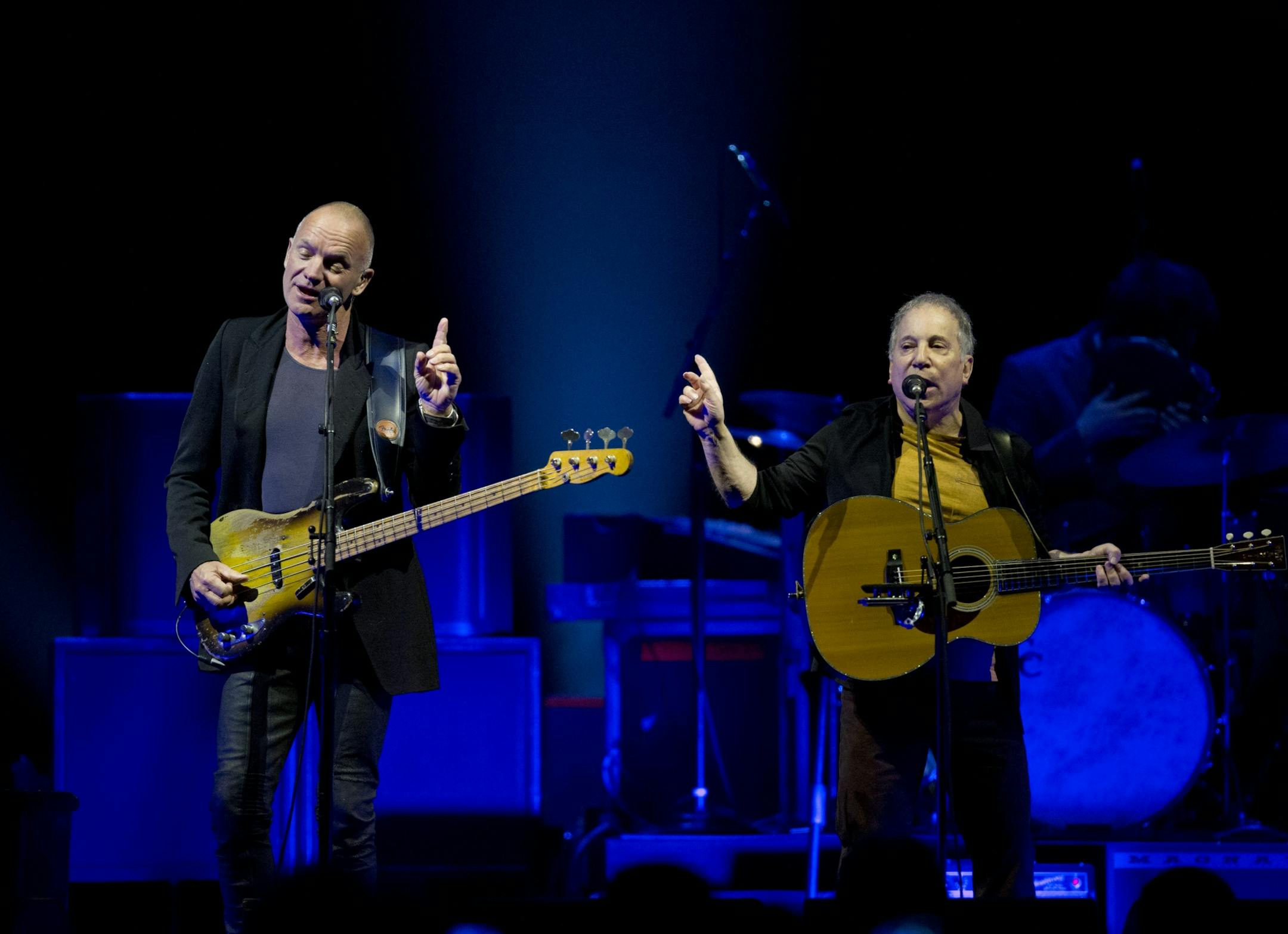Longtime New York neighbors Sting and Paul Simon decided to hit the road and tour together. The Paul Simon & Sting: On Stage Together tour stopped at Xcel Energy Center in St. Paul Sunday night, February 23, 2014. Sting, left, and Paul Simon performing Sting's "Brand New Day" to open their set Sunday night at Xcel Energy Center.