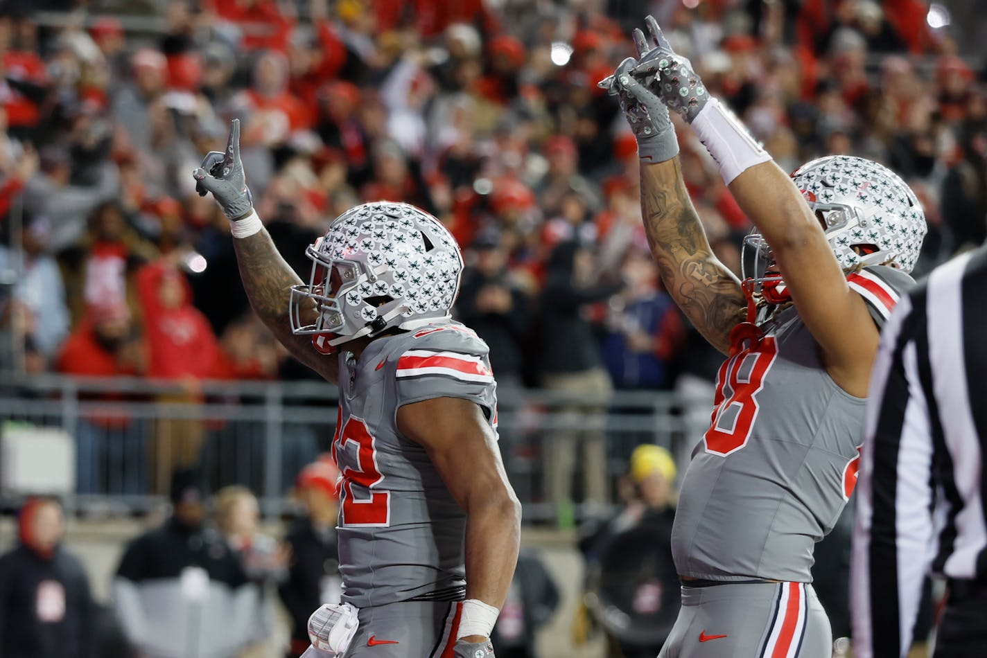 Ohio State running back TreVeyon Henderson, left, and tight end Gee Scott celebrate Henderson's touchdown against Michigan State during the first half of an NCAA college football game Saturday, Nov. 11, 2023, in Columbus, Ohio. (AP Photo/Jay LaPrete)