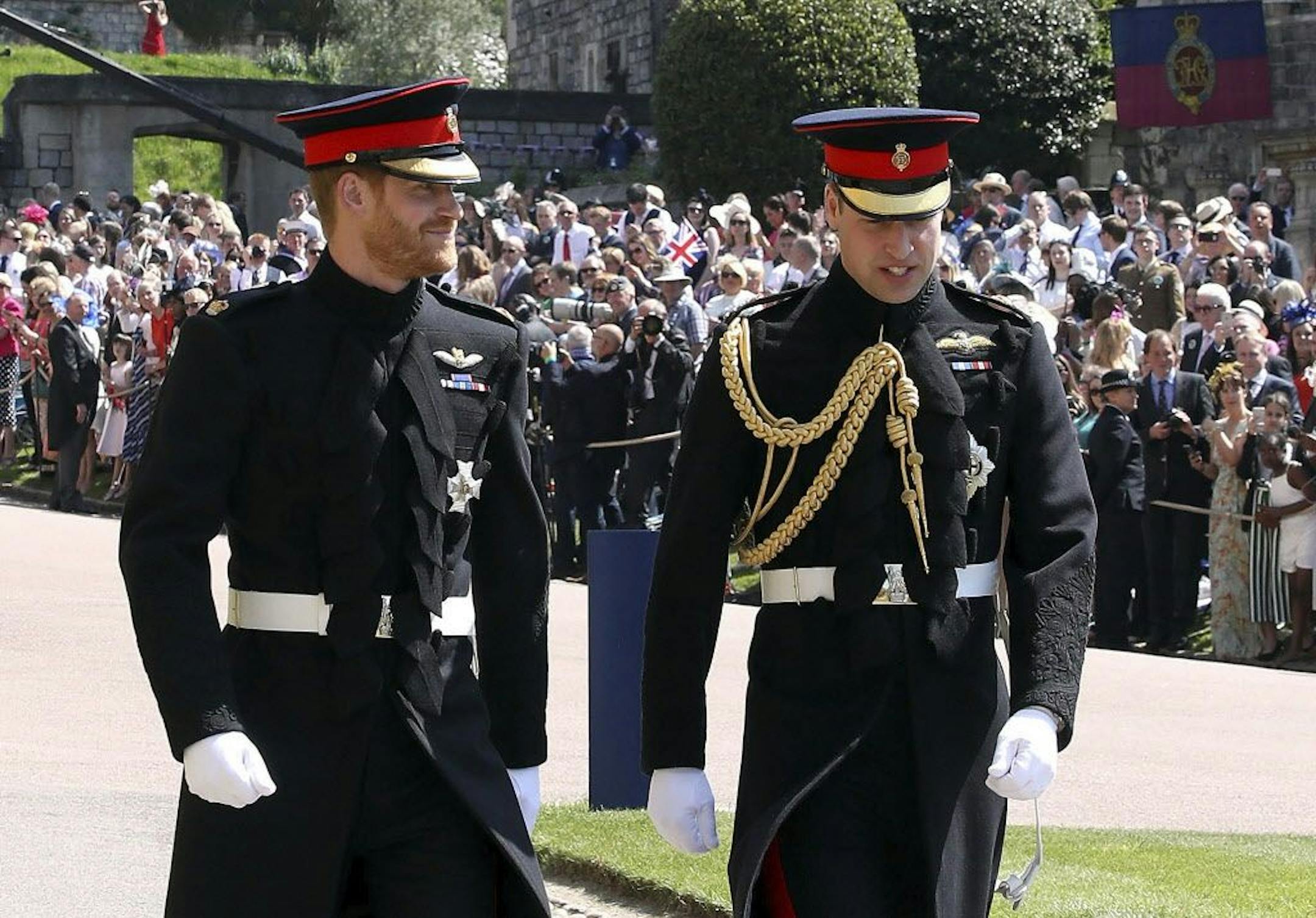 Britain's Prince Harry, left, and Prince William arrive for the wedding ceremony of Prince Harry and Meghan Markle at St. George's Chapel in Windsor Castle in Windsor, near London, England, Saturday, May 19, 2018.