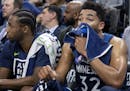Minnesota Timberwolves Andrew Wiggins (22) and Karl-Anthony Towns (32) watched from the bench in the final minute of the game. ] CARLOS GONZALEZ &#xef