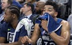 Minnesota Timberwolves Andrew Wiggins (22) and Karl-Anthony Towns (32) watched from the bench in the final minute of the game. ] CARLOS GONZALEZ &#xef