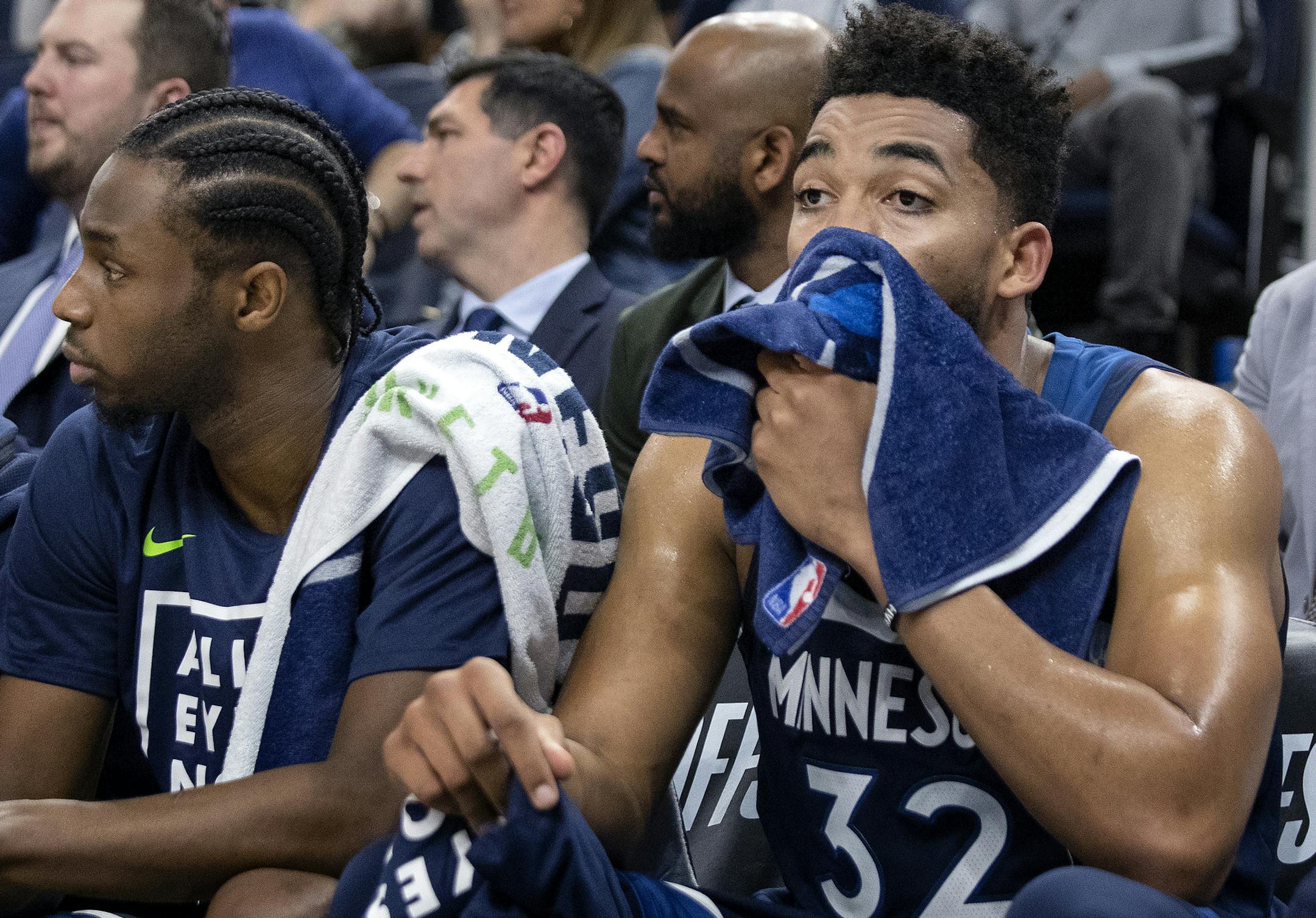 Minnesota Timberwolves Andrew Wiggins (22) and Karl-Anthony Towns (32) watched from the bench in the final minute of the game. ] CARLOS GONZALEZ ï cgonzalez@startribune.com ñ April 23, 2018, Minneapolis, MN, Target Center, NBA Playoffs, Basketball, Minnesota Timberwolves vs. Houston Rockets, Game 4