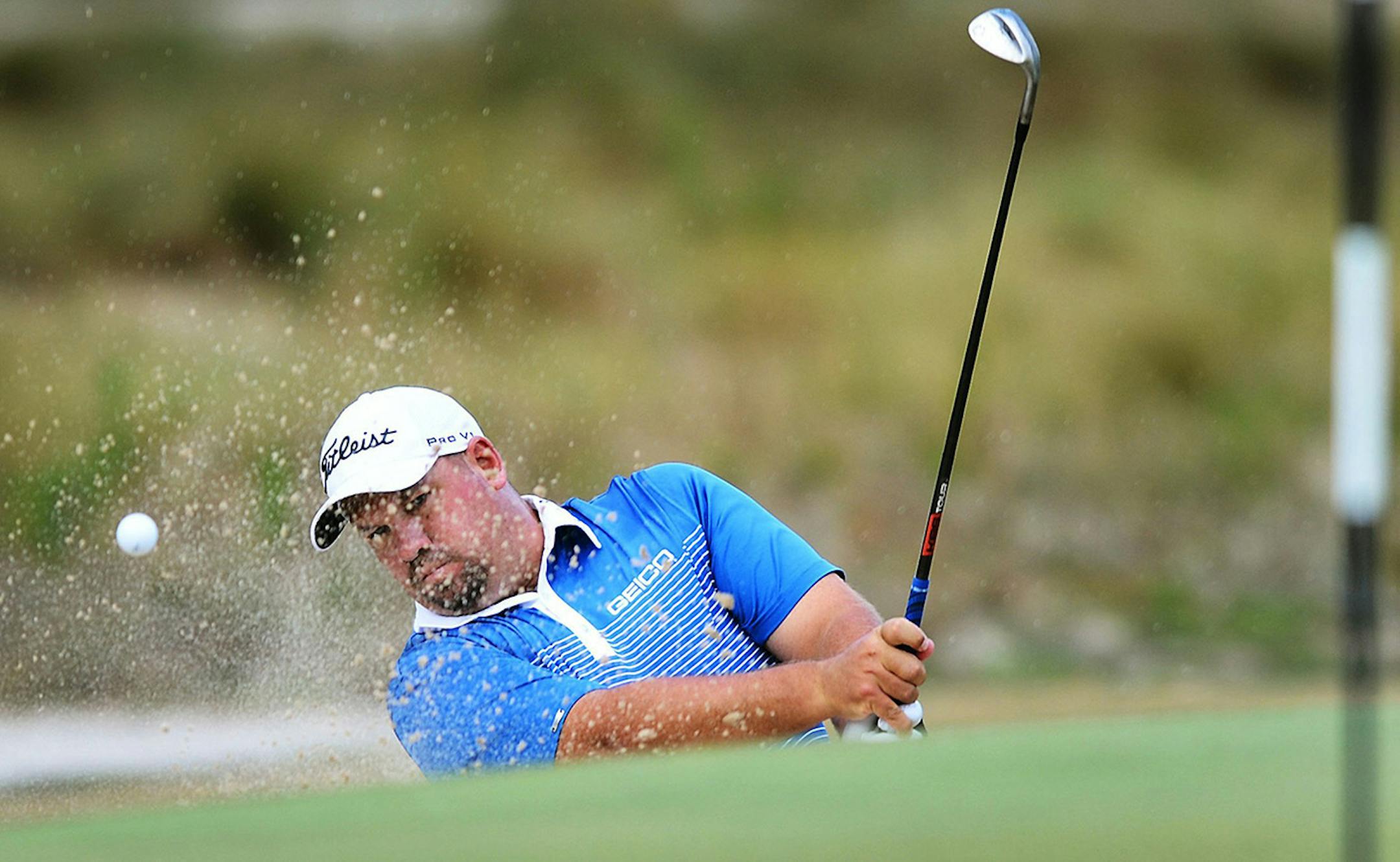 Brendon De Jonge hits from a sand trap at the seventh green during third-round action at the 2014 U.S. Open at Pinehurst 2 in Pinehurst, N.C., Saturday, June 14, 2014.