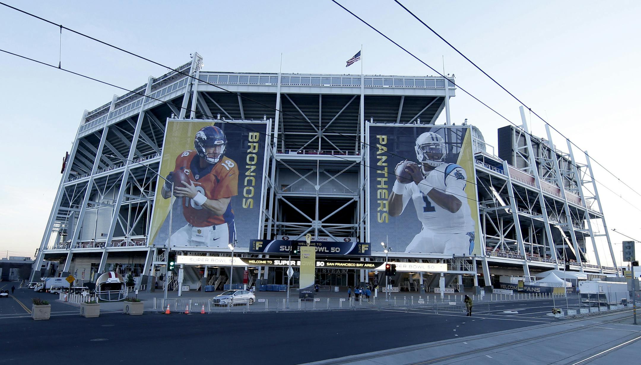 Banners for the Denver Broncos and Carolina Panthers hang outside Levi's Stadium in advance of Sunday's NFL Super Bowl 50 football game Friday, Feb. 5, 2016, in Santa Clara, Calif. (AP Photo/Charlie Riedel)