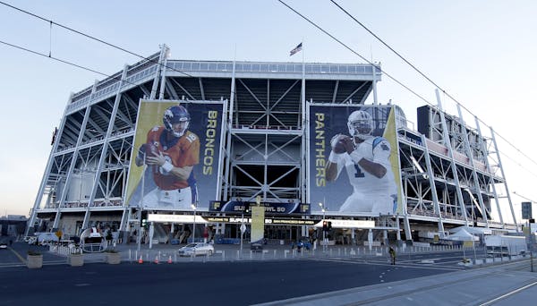 Banners for the Denver Broncos and Carolina Panthers hang outside Levi's Stadium in advance of Sunday's NFL Super Bowl 50 football game Friday, Feb. 5