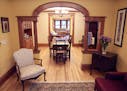 Cherry-stained woodwork and a built-in dining room hutch add period character to the renovated Victorian cottage, one of 52 homes open for the Mpls. &