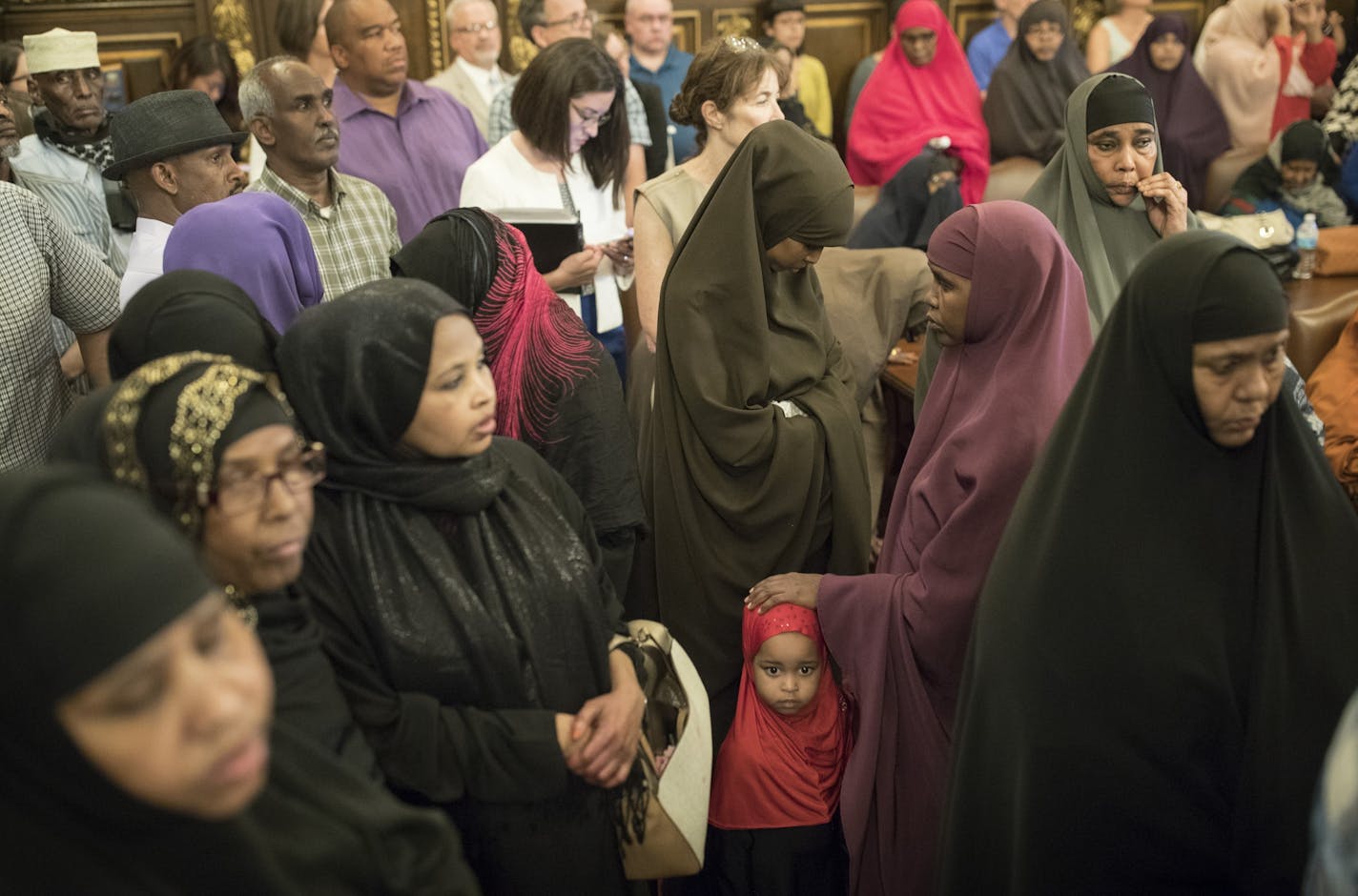 Members of the Somali community listened as Governor Mark Dayton spoke about latest developments in the Justine Damond shooting at the capitol Wednesday July 19, 2017 in St. Paul, MN.