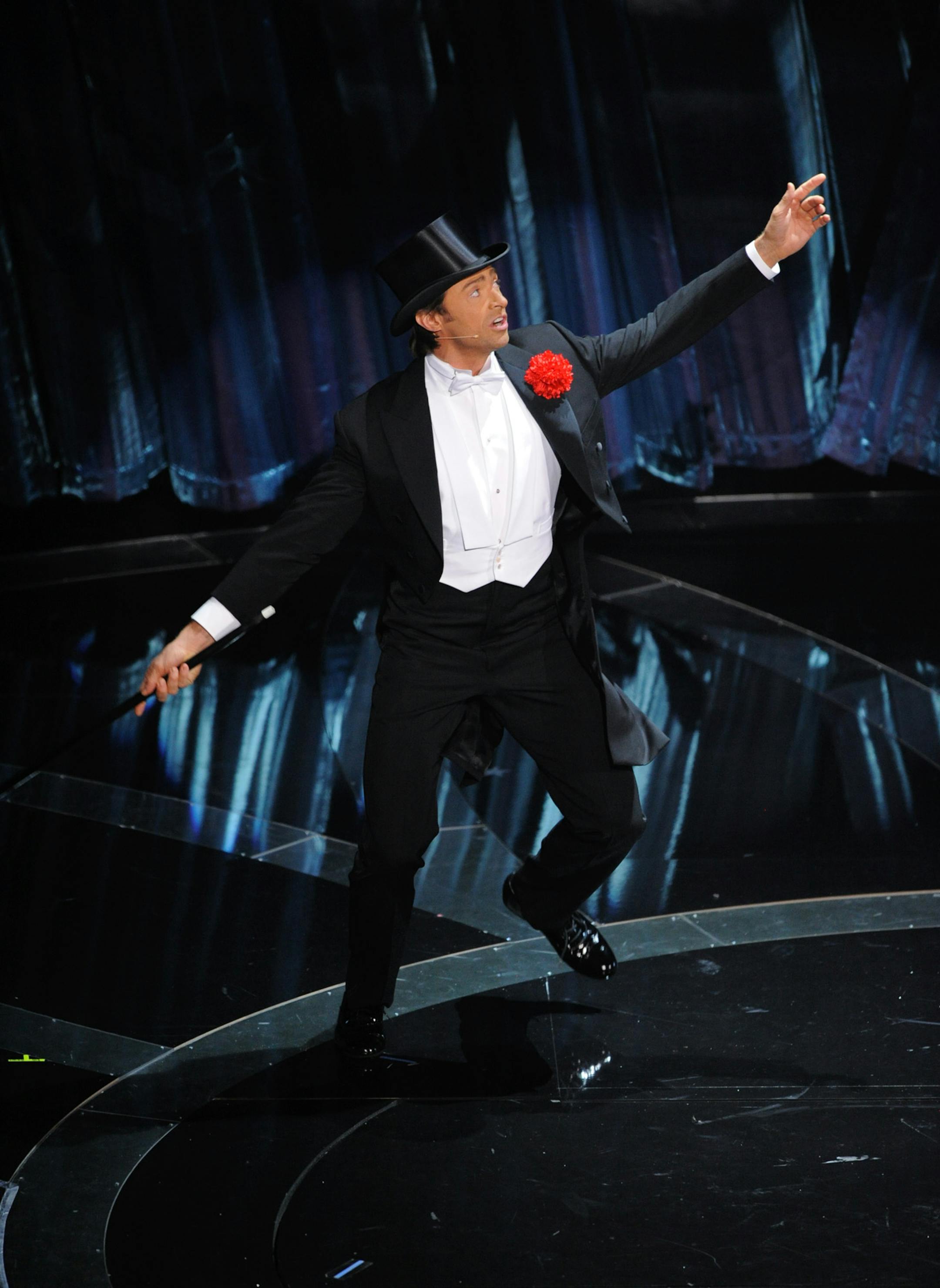 **EMBARGOED AT THE REQUEST OF THE ACADEMY OF MOTION PICTURE ARTS & SCIENCES FOR USE UPON CONCLUSION OF THE ACADEMY AWARDS TELECAST**Oscar host Hugh Jackman dances during the 81st Academy Awards Sunday, Feb. 22, 2009, in the Hollywood section of Los Angeles. (AP Photo/Mark J. Terrill) ORG XMIT: MIN2013021818000668