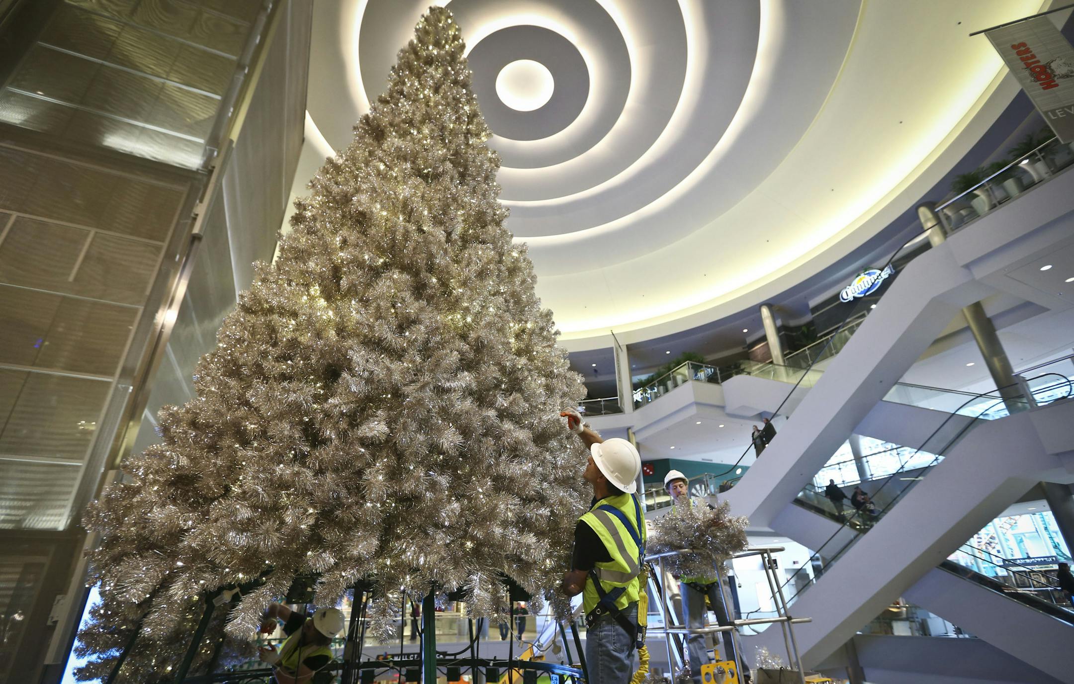 Mall contractor Casey Kraft put together an oversized tree in the Rotunda at the Mall of America on Thursday, November 7, 2013 in Bloomington, Minn. ] RENEE JONES SCHNEIDER • reneejones@startribune.com