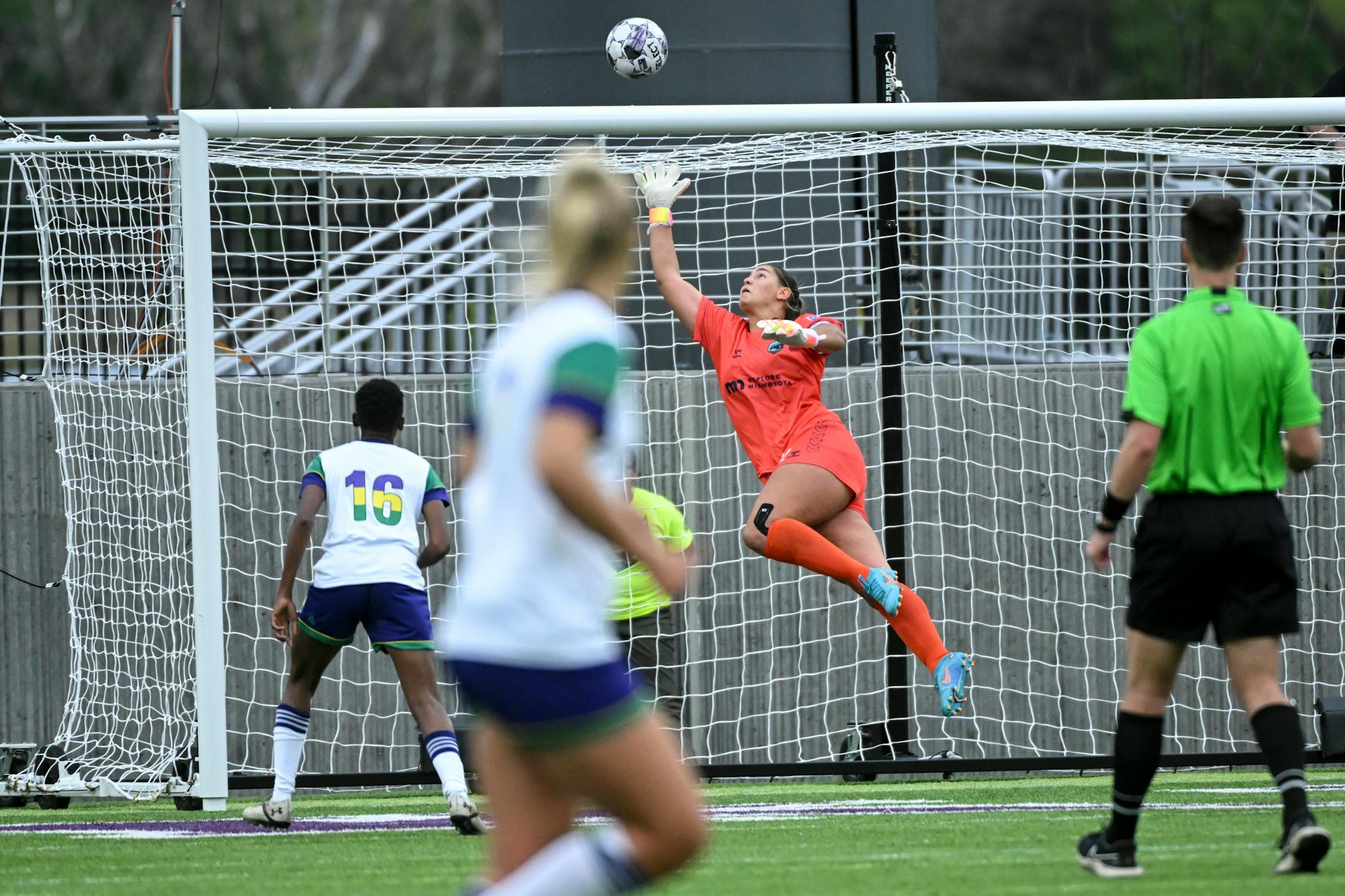 Minnesota goalkeeper Sarah Fuller makes a save during the first half of the match.