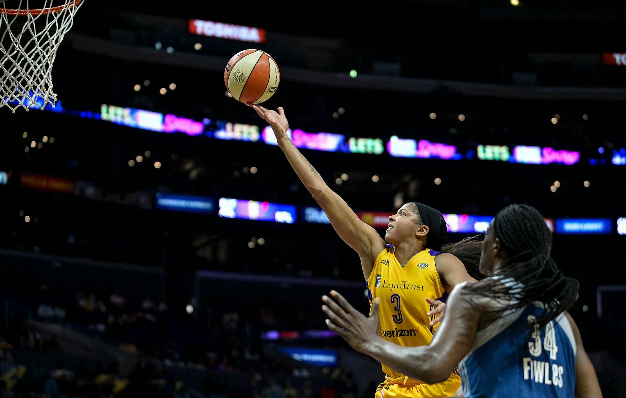 Los Angeles Sparks forward Candace Parker (3) scored a layup while being defended by Minnesota Lynx center Sylvia Fowles (34) in the second half.
