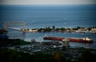 A shipping vessel navigated through Duluth's Harbor before heading out into Lake Superior Wednesday night. (AARON LAVINSKY/Star Tribune)