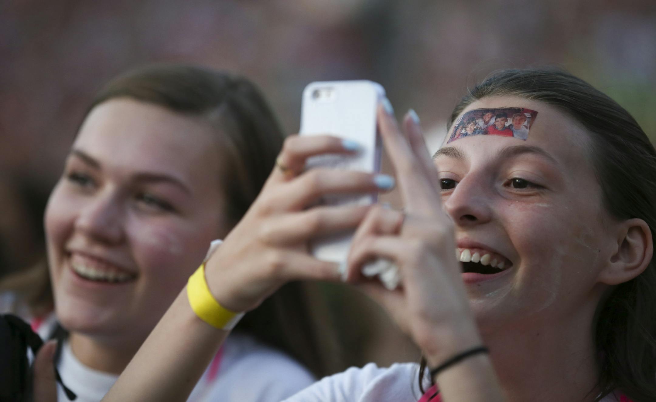 Young fans near the front of the stage recorded the first song by One Direcction Sunday night at TCF Bank Stadium. ] JEFF WHEELER ï jeff.wheeler@startribune.com The boy band One Direction landed at TCF Bank Stadium for a show on their On the Road Again Tour 2015 Sunday night, July 26, 2015 in Minneapolis. Swedish electropop duo Icona Pop opened.