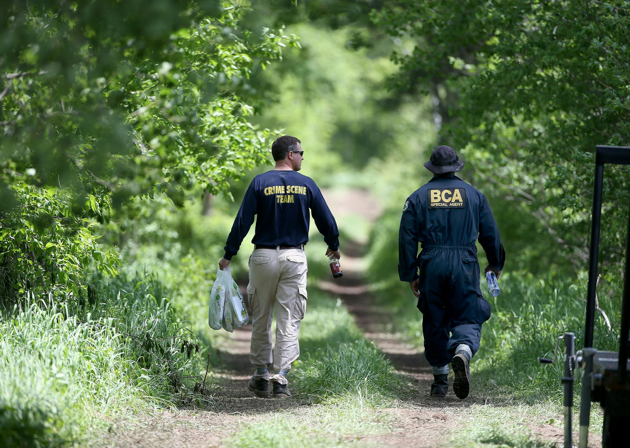 Members of the BCA made their way into a search area in Stanchfield, MN, Tuesday, June 3, 2014. On Monday, June 2, 2014 at approximately 9:00 a.m., the Maple Grove Police Department executed a search warrant near the 37000 block of Verdin Street NW, Stanchfield, MN. The search is part of the 1989 missing Amy Sue Pagnac case. ] (ELIZABETH FLORES/STAR TRIBUNE) ELIZABETH FLORES • eflores@startribune.com