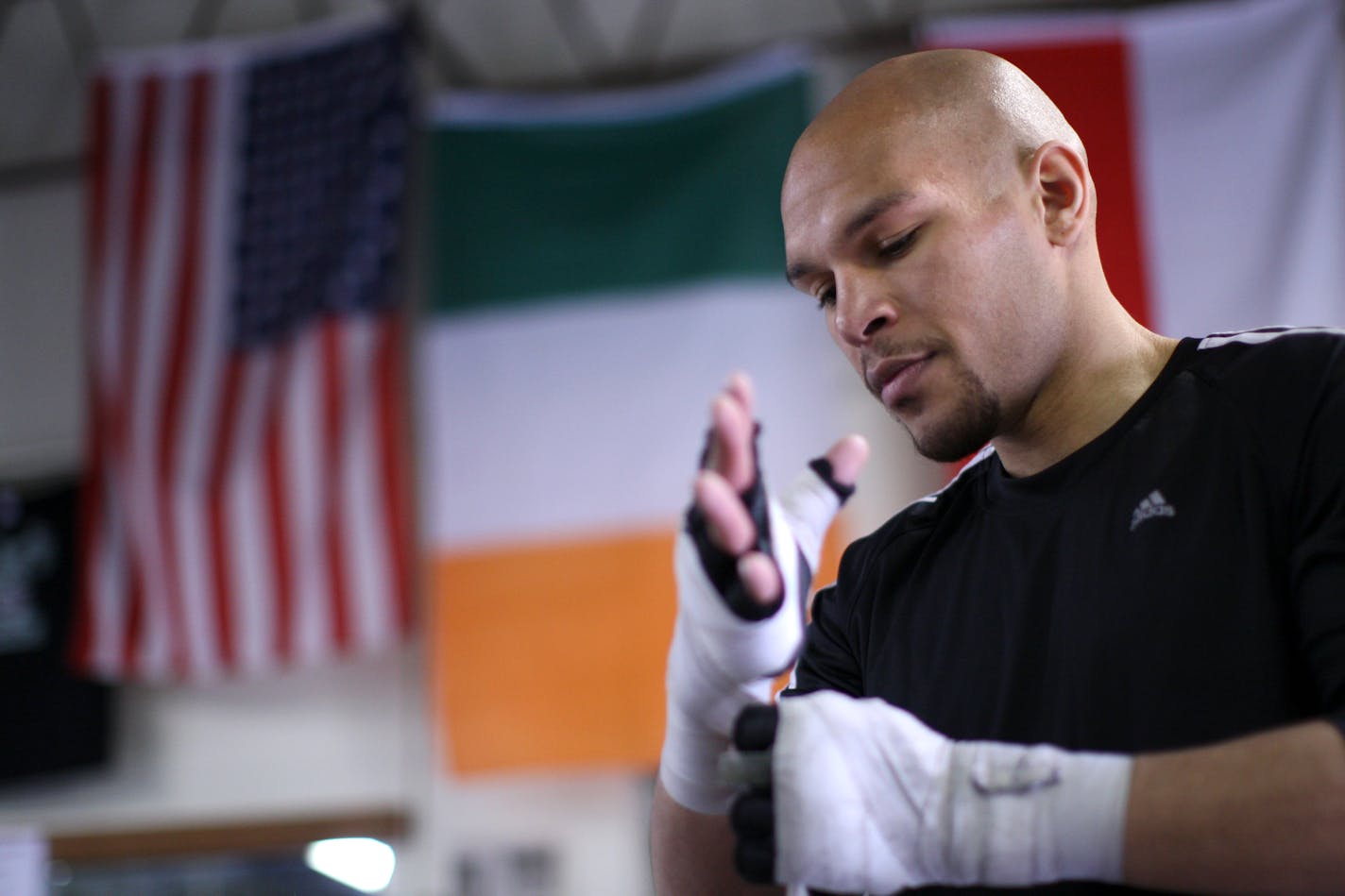 Caleb Truax wrapped his hands before he began his workout at Lyke's Anoka-Coon Rapids Boxing Gym in Coon Rapids Monday afternoon.