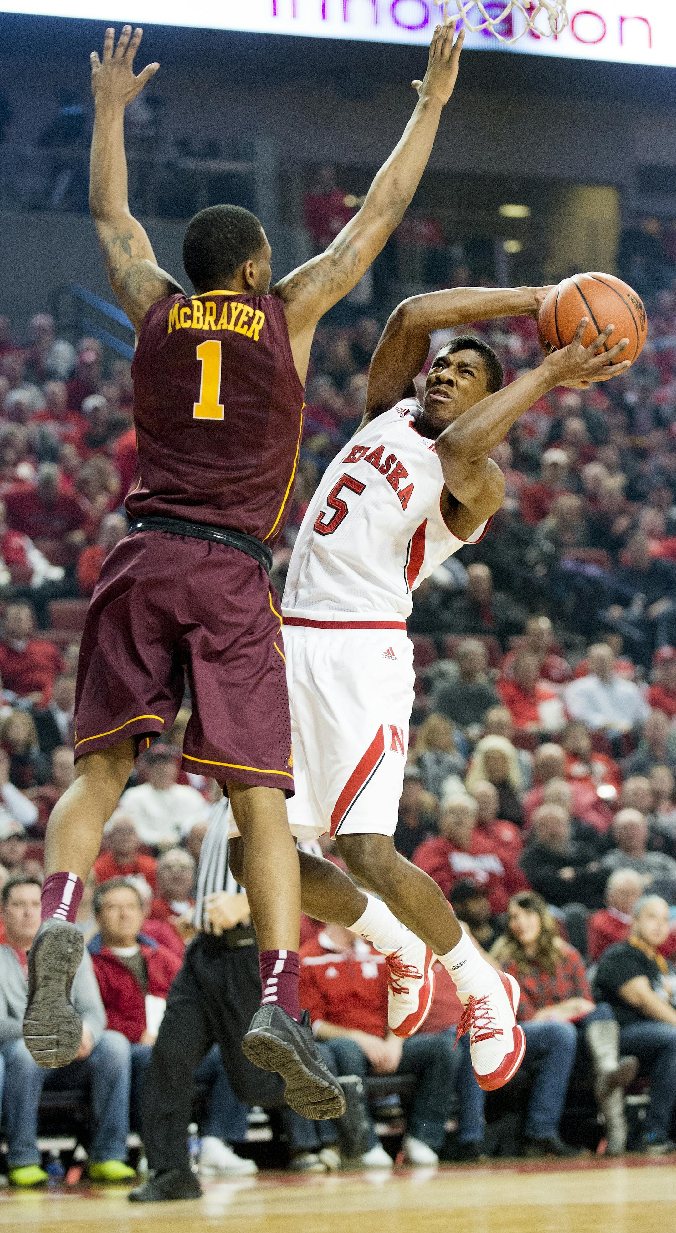 Nebraska guard Glynn Watson Jr. (5) drives against Minnesota guard Dupree McBrayer (1) during the first half of an NCAA college basketball game in Lincoln, Neb., Tuesday, Jan. 12, 2016. (Francis Gardler/The Journal-Star via AP) LOCAL TELEVISION OUT; KOLN-TV OUT; KGIN-TV OUT; KLKN-TV OUT; MANDATORY CREDIT