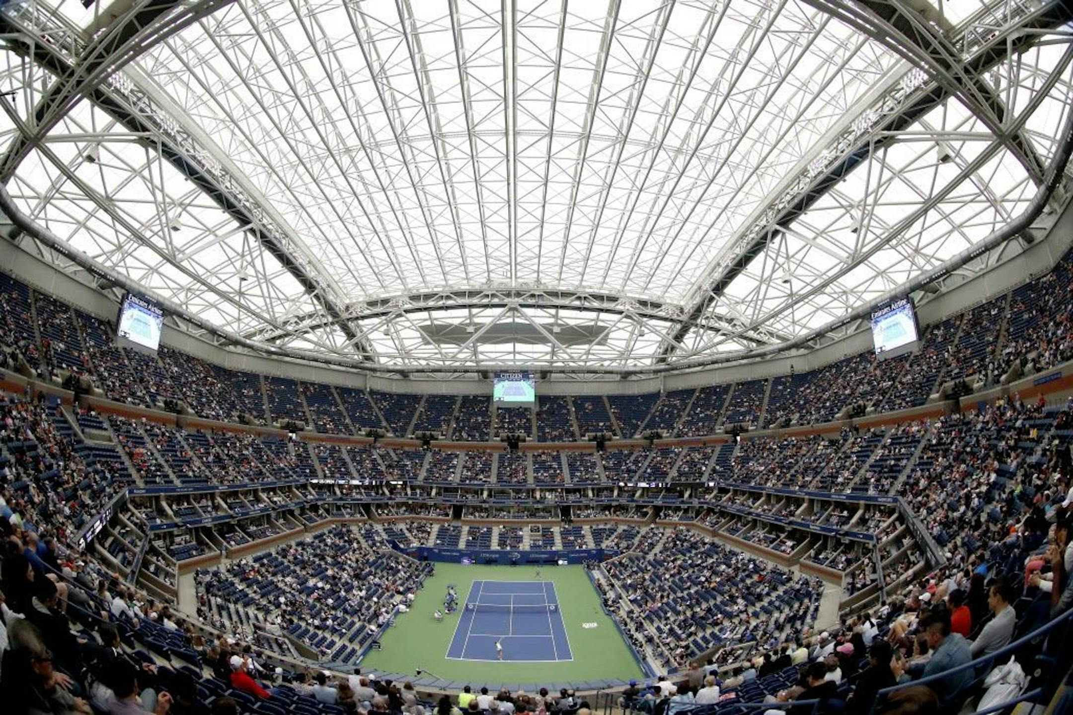 FILE- In this Sept. 6, 2017 file photo, fans fill the stands at Arthur Ashe stadium as Karolina Pliskova, of Czech Republic, plays CoCo Vandeweghe, of the United States, during the quarterfinals of the U.S. Open tennis tournament in New York.