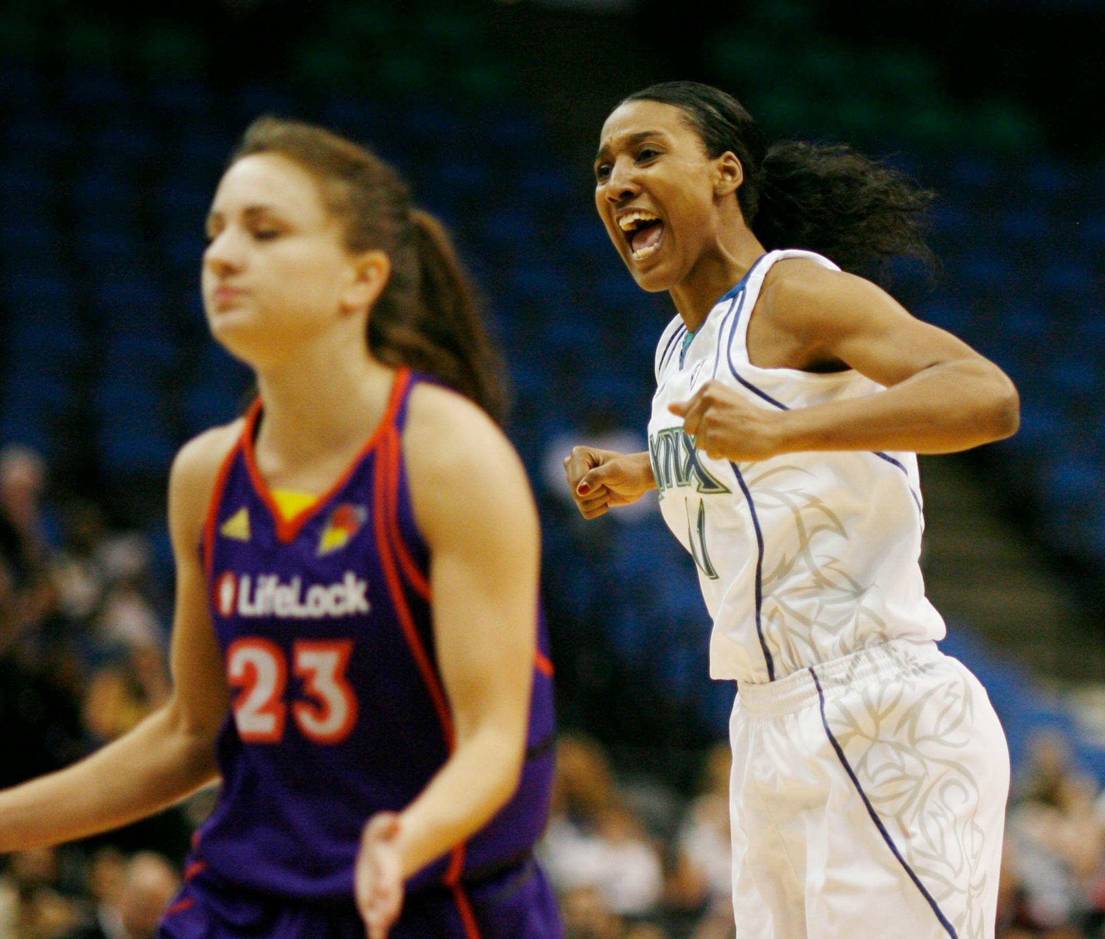 Candice Wiggins (right) had eight points in her first action of the season for the Lynx.