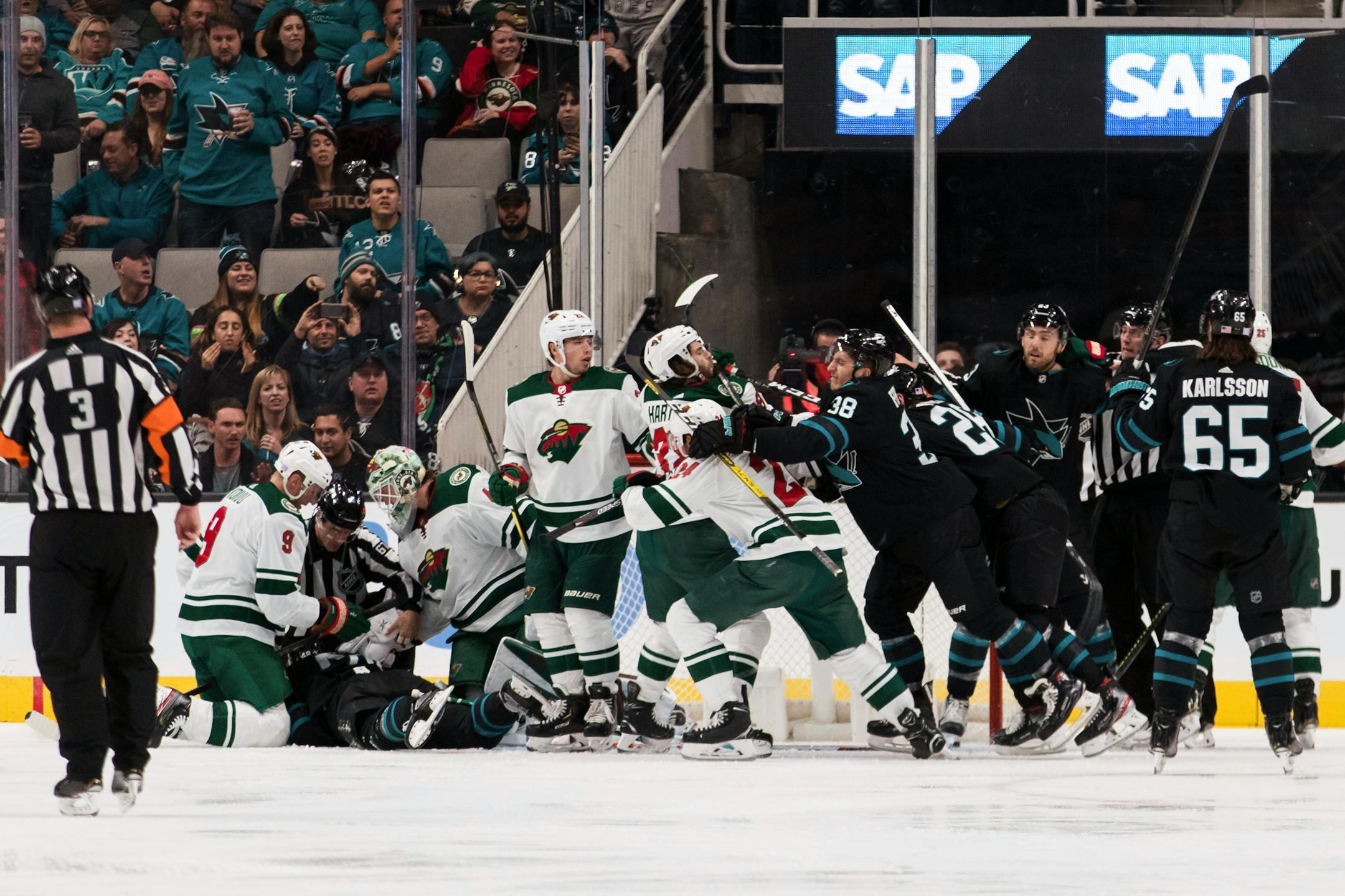 A fight breaks out between the San Jose Sharks and the Minnesota Wild during the second period of an NHL hockey game Thursday, Nov. 7, 2019, in San Jose, Calif. (AP Photo/John Hefti)