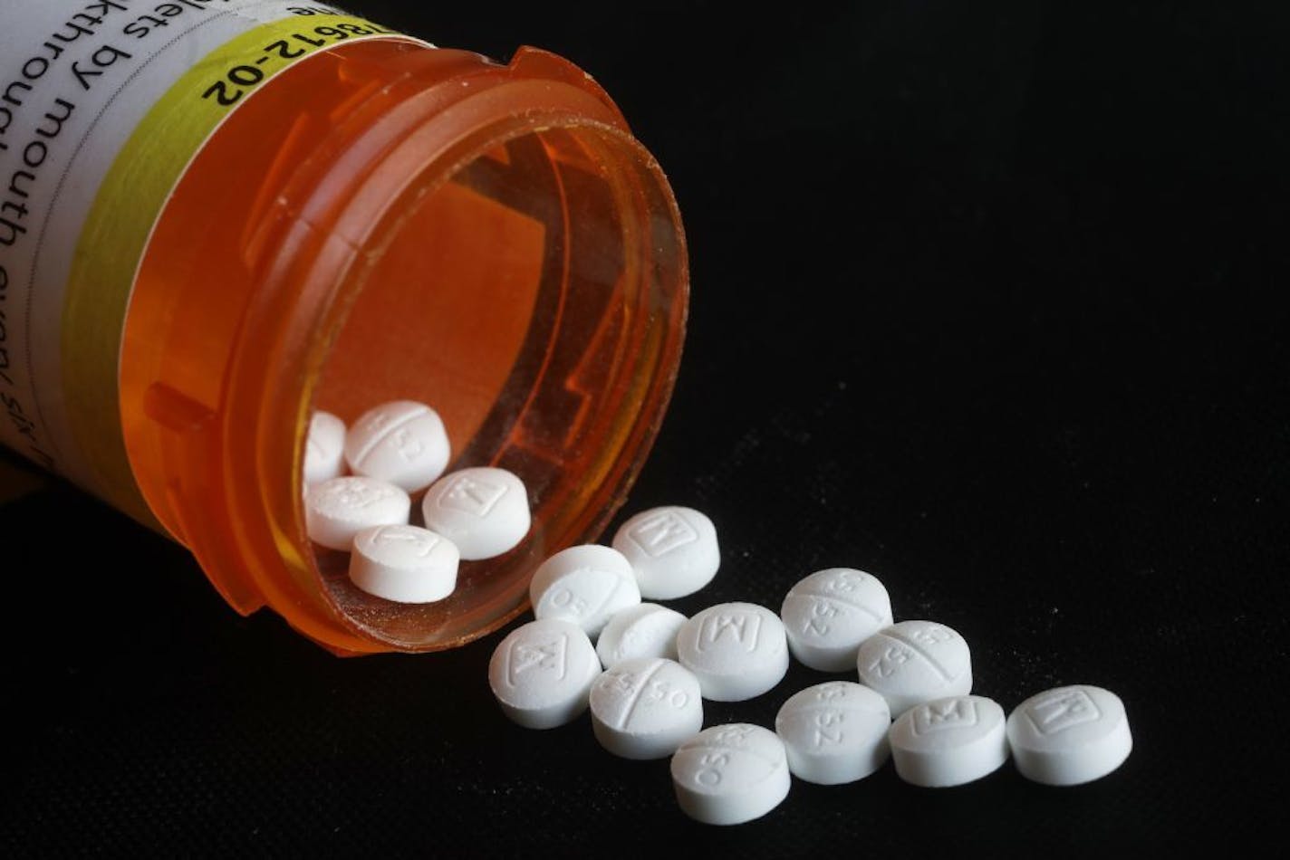 This Aug. 29, 2018 photo shows an arrangement of prescription Oxycodone pills in New York. Figures from a 2017 survey released on Friday, Sept. 14, 2018, show fewer people used heroin for the first time compared to the previous year, and fewer Americans misusing or addicted to prescription opioid painkillers.