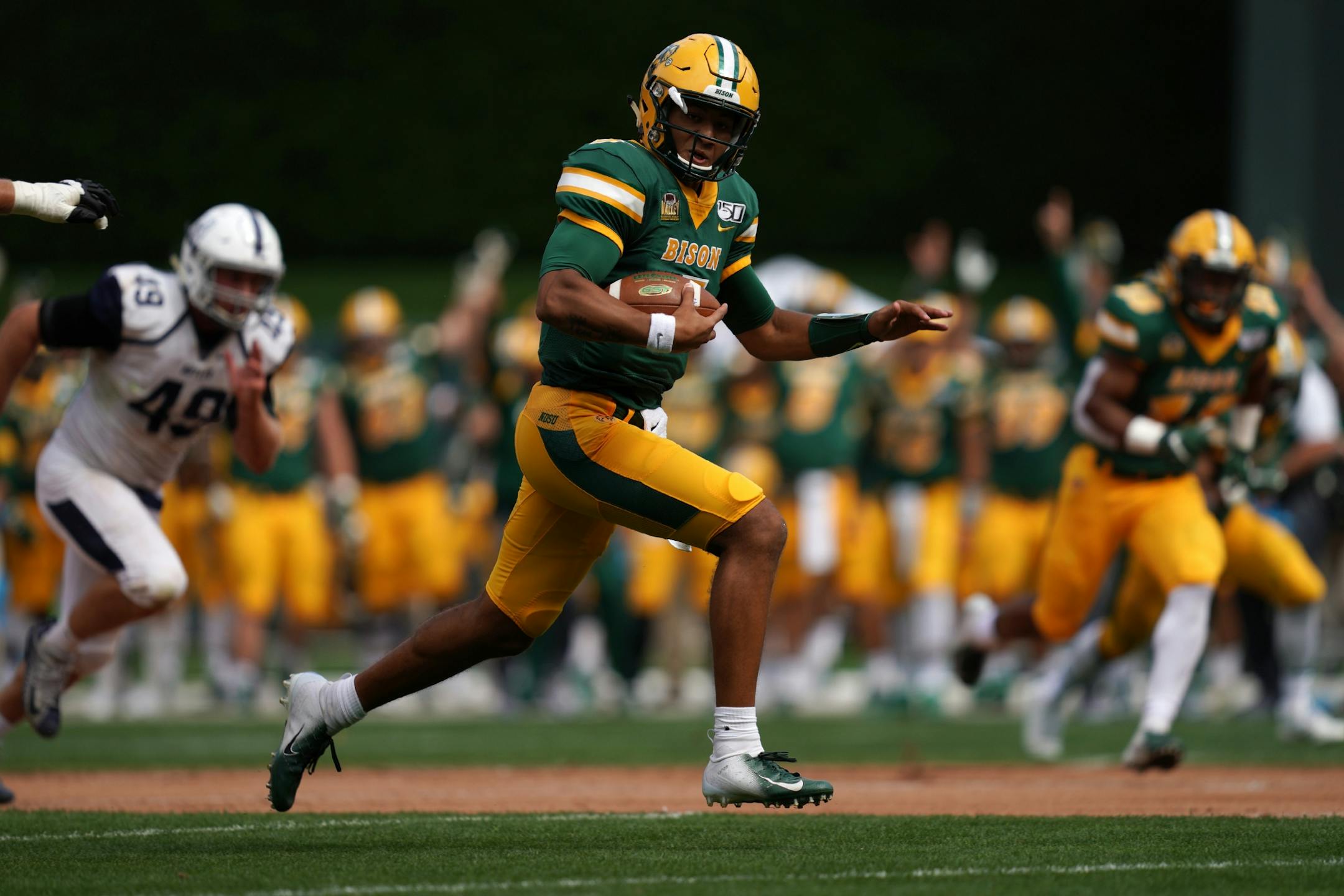 North Dakota State Bison quarterback Trey Lance (5) sprinted into the end zone for a touchdown in the first half.