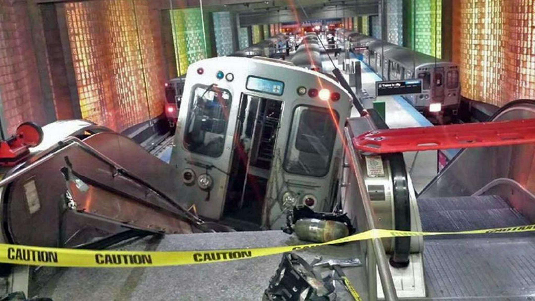 A Chicago Transit Authority train car rests on an escalator at the O'Hare Airport station after it derailed early Monday, March 24, 2014, in Chicago.