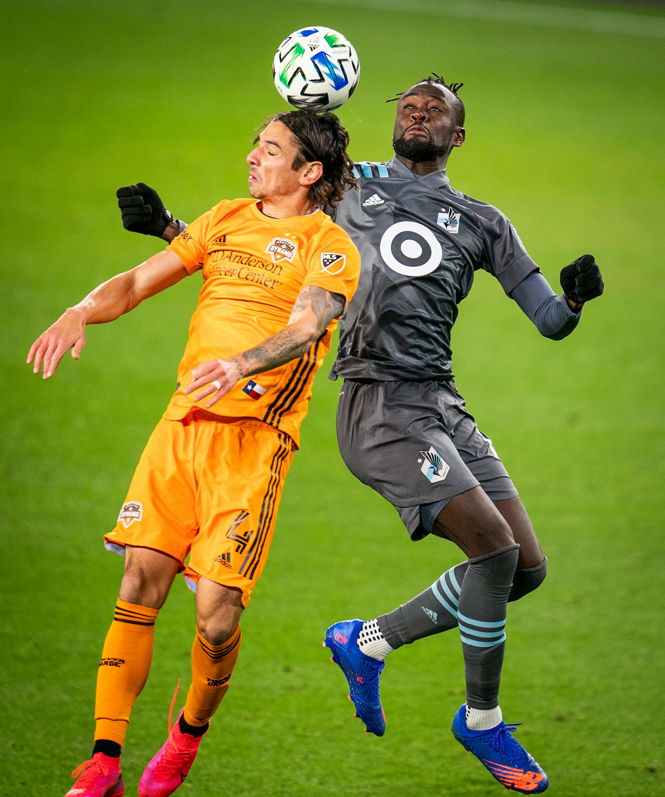 Minnesota United forward Kei Kamara (16), right, went up for a header with Houston Dynamo defender Zarek Valentin (4) during the second half.