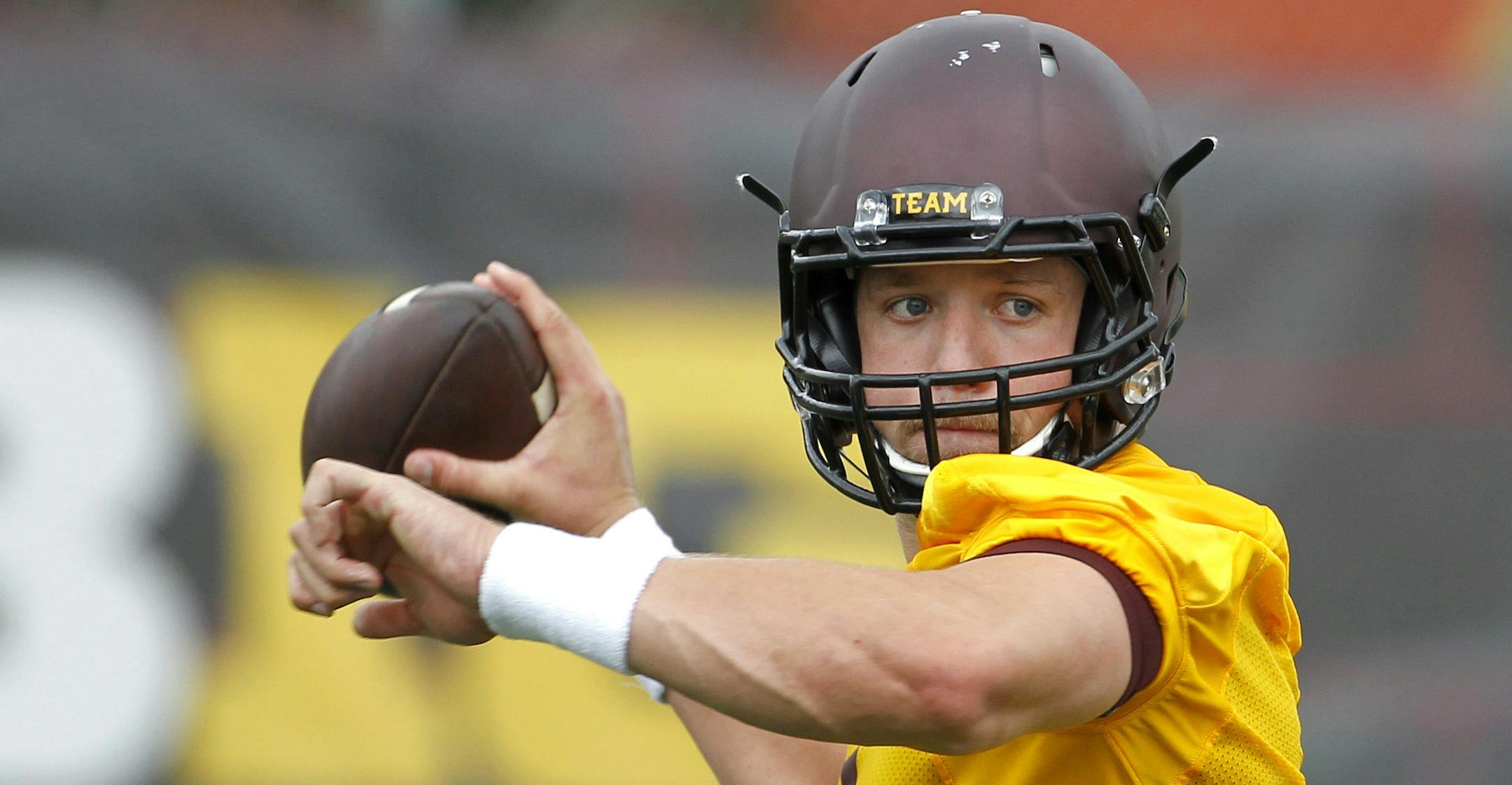 Minnesota quarterback Mitch Leidner drops back for a pass during NCAA college football training camp in Minneapolis Friday, Aug. 7, 2015. (AP Photo/Ann Heisenfelt)