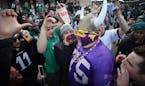 Vikings fan Andrew Grein of Edina, walked through a crowd of hostile Eagle fans before kickoff of the NFC Championship game at Lincoln Financial Field