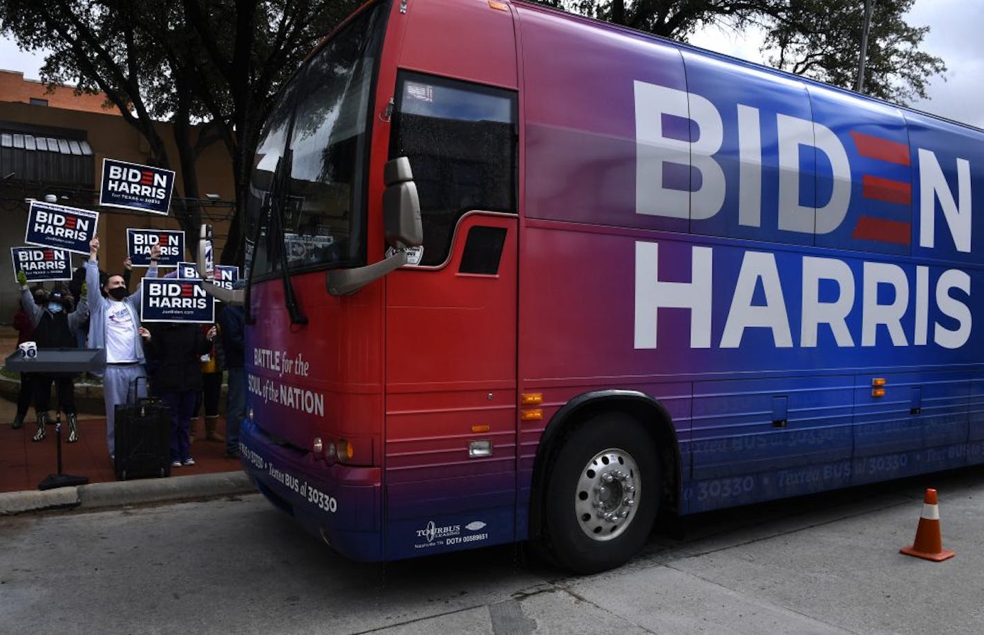 Supporters cheered as the Biden-Harris campaign bus arrived at Vera Minter Park on Wednesday, Oct. 28, 2020, in Abilene, Texas. The FBI is looking into a Saturday incident where a Biden bus headed to an event in Austin was surrounded by vehicles with Trump flags leading to a collision.