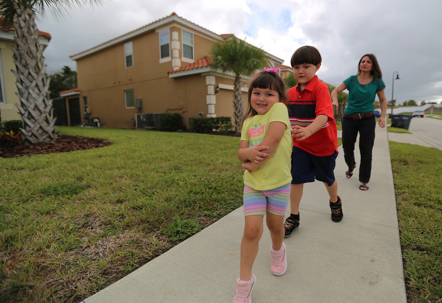 From left, Julie, 3; Jason, 7, and mom Lissette Lanza outside a rental home in Davenport, on Monday, Nov. 12, 2018. KeyVilla operates vacation homes in Miami and Orlando, and they created a listing of vacation homes for people with autism where little things, like the doorbell or the wall paint, is designed to be more soothing.