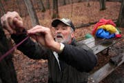 Bob Naslund, who has camped at least once a month for 42 consecutive years, ran a ridge line for his tarp at his campsite at Lake Maria State Park nea