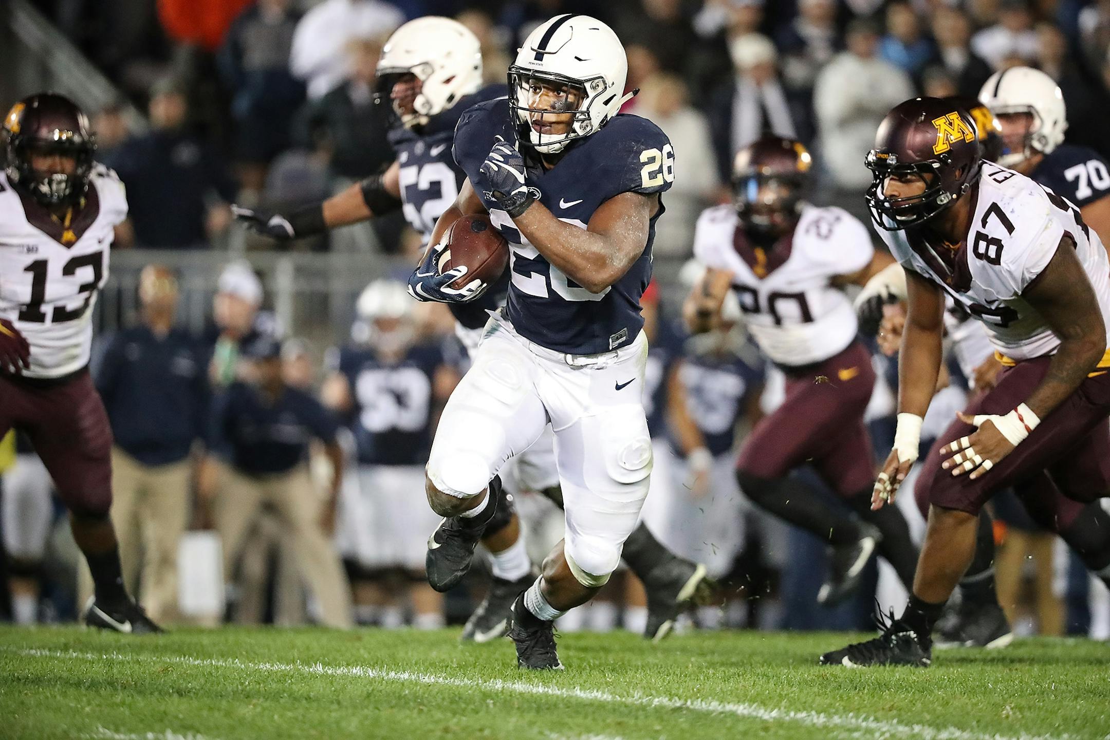 Penn State's running back Saquon Barkley broke away from Minnesota's defensive lineman Gaelin Elmore to score the winning touchdown beating Minnesota 29-23 in overtime at Beaver Stadium, Saturday, October 1, 2016 in State College, PA.