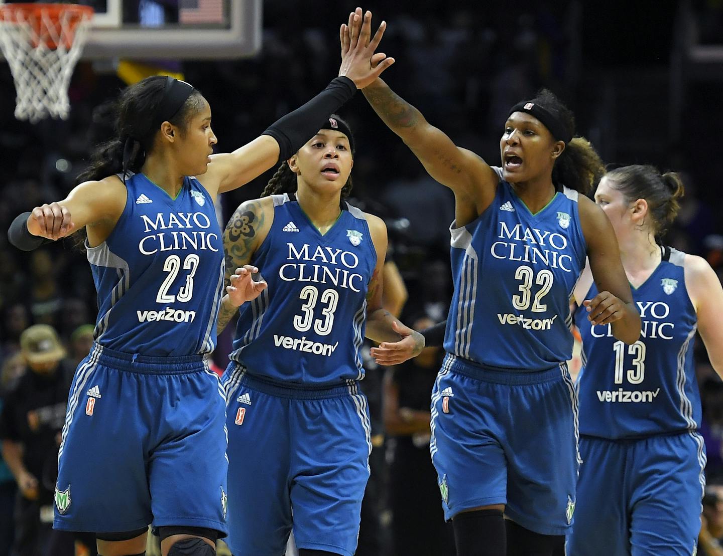 Members of the Minnesota Lynx, from left, Maya Moore, Seimone Augustus, Rebekkah Brunson and Lindsay Whalen celebrate during the second half in Game 4 of the WNBA Finals against the Los Angeles Sparks, Sunday, Oct. 16, 2016, in Los Angeles. The Lynx won 85-79. (AP Photo/Mark J. Terrill)