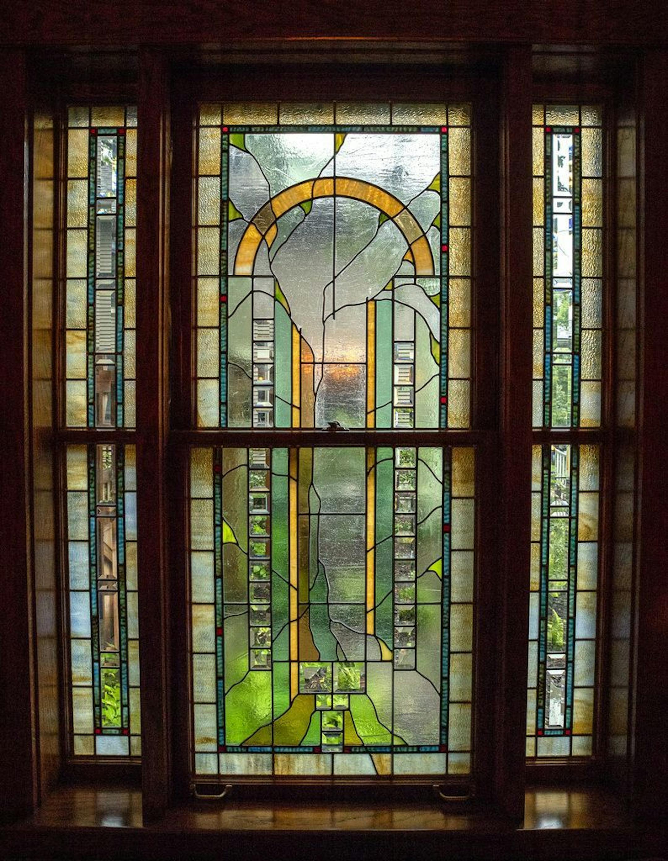 A new stained-glass window in the dining room by Minnesota artist Michael Pilla.