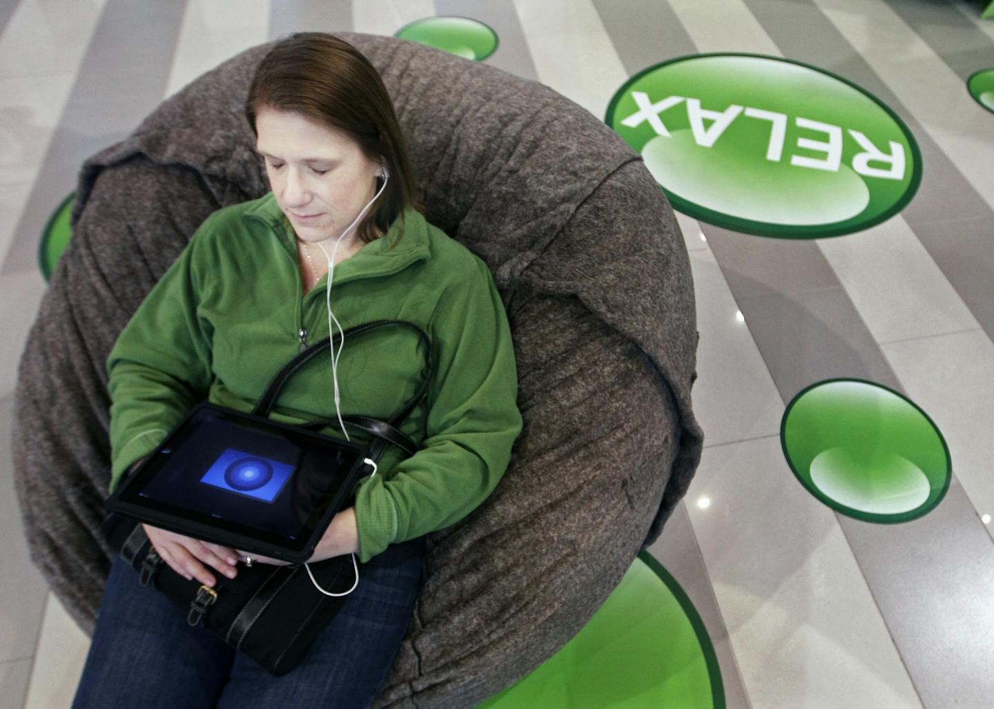 Jennifer Roeller of Bayport listened to a meditation app on an iPad at the Mayo Clinic&#x2019;s Healthy Living outpost at the MOA.