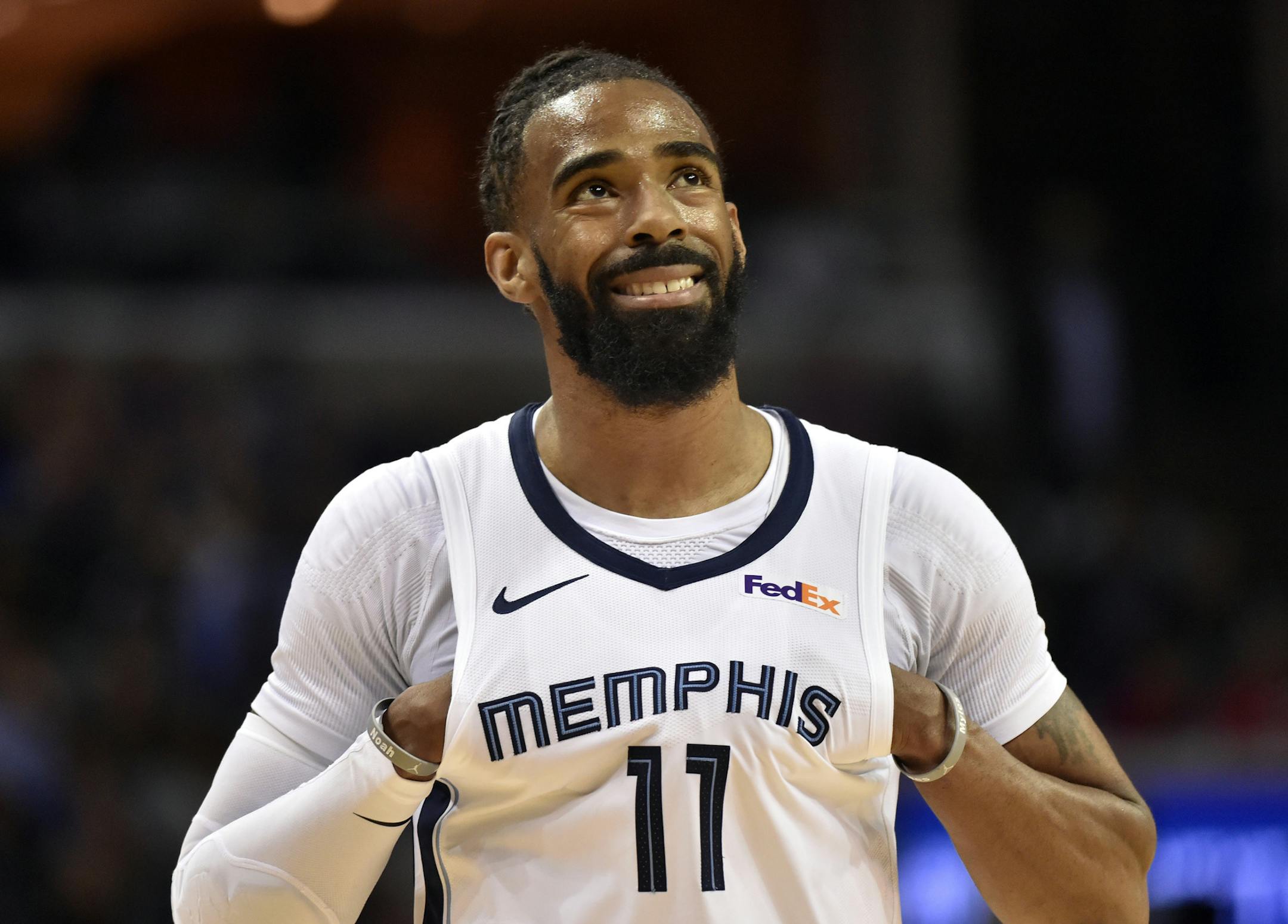 Memphis Grizzlies guard Mike Conley (11) stands on the court in the first half of an NBA basketball game against the Golden State Warriors Wednesday, March 27, 2019, in Memphis, Tenn. Conley passed Marc Gasol as the franchise's all-time scorer during the game. (AP Photo/Brandon Dill) ORG XMIT: TNBD102