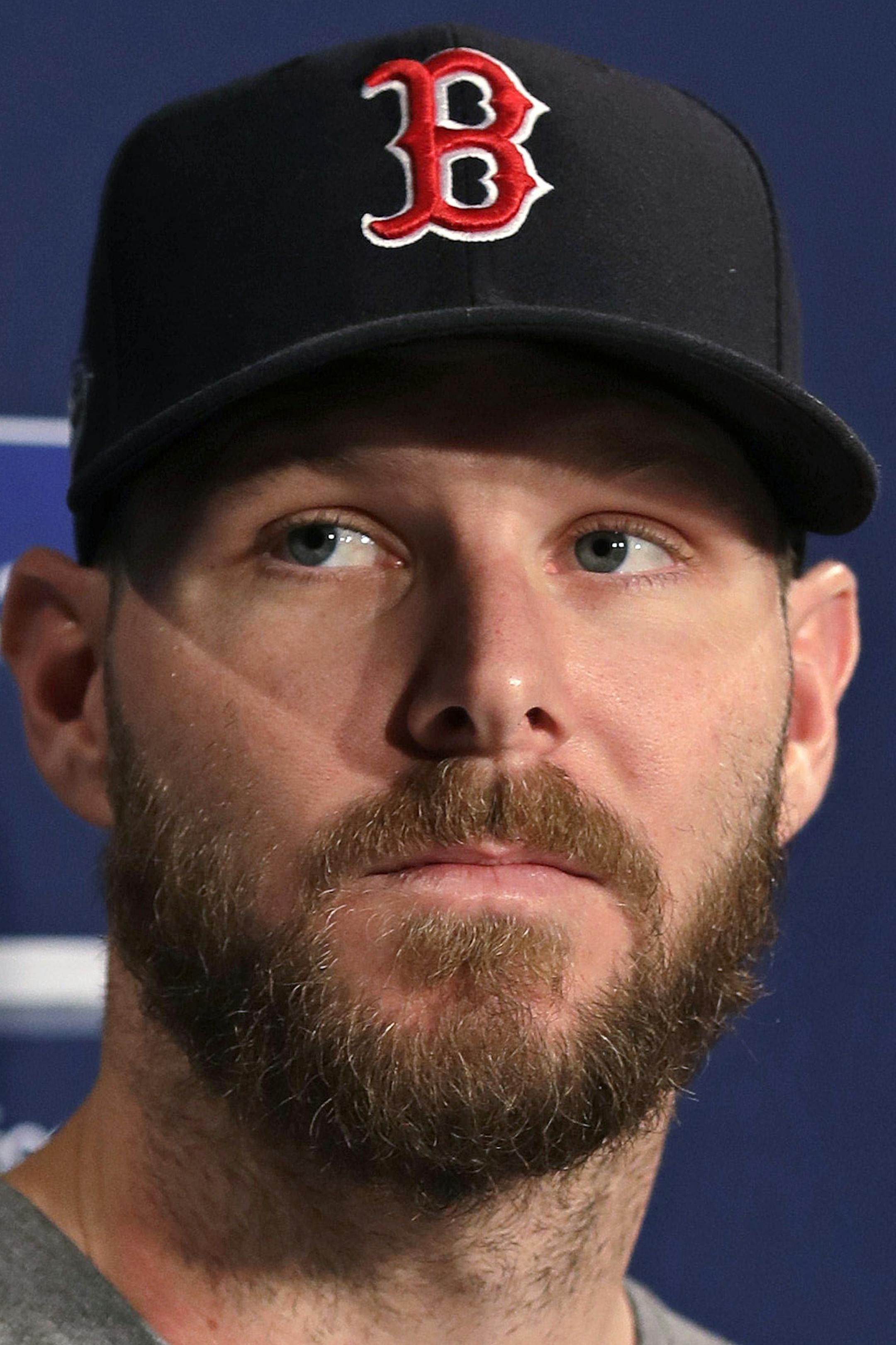 Boston Red Sox starting pitcher Chris Sale listens to a question during a news conference prior to a workout at Fenway Park, Friday, Oct. 12, 2018, in Boston. The Red Sox face the Houston Astros in Game 1 of baseball's American League Championship on Saturday. (AP Photo/Charles Krupa)
