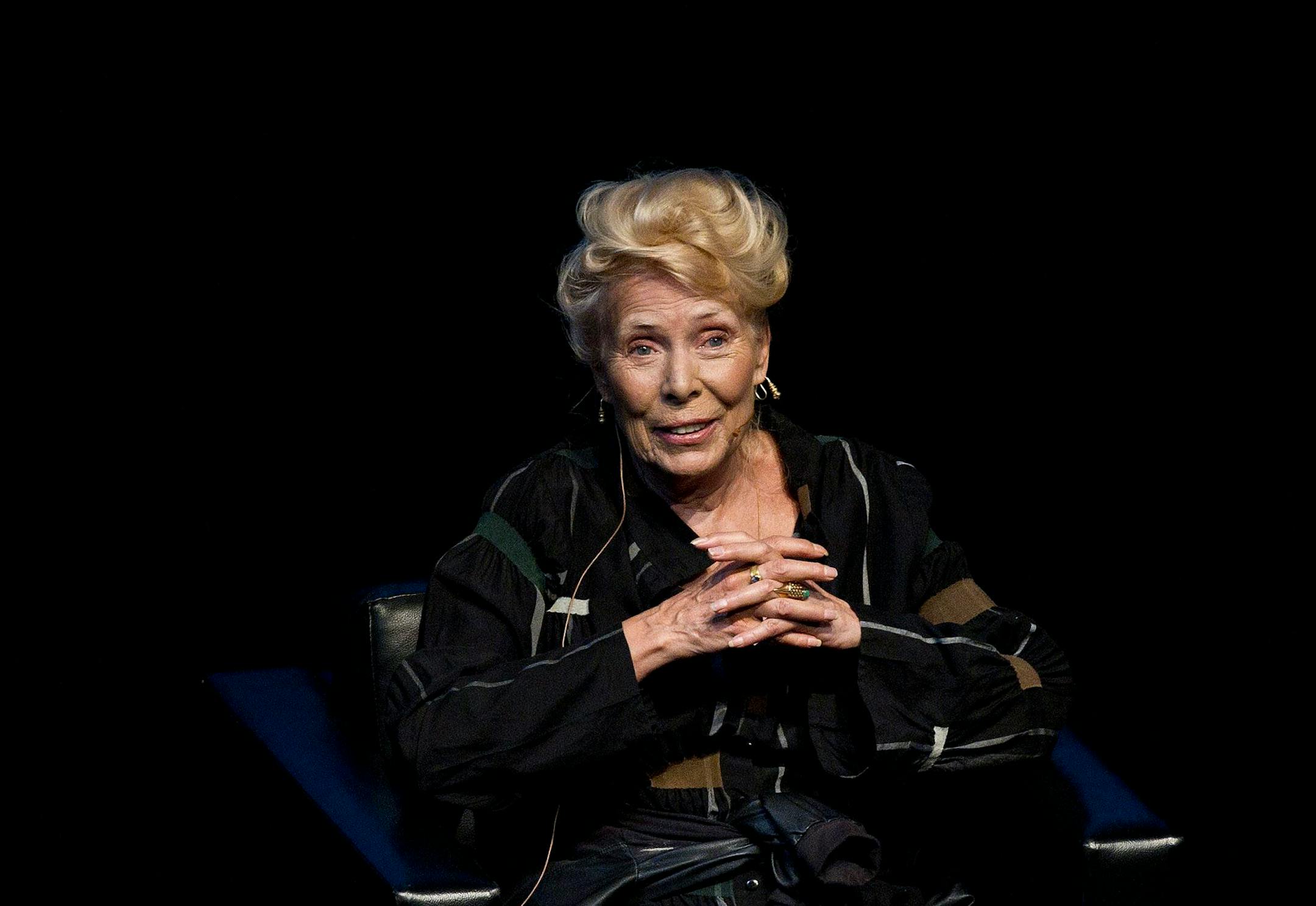 FILE -- Joni Mitchell speaks at the Isabel Bader Theatre as part of Luminato festival, Sunday, June 16, 2013, in Toronto.