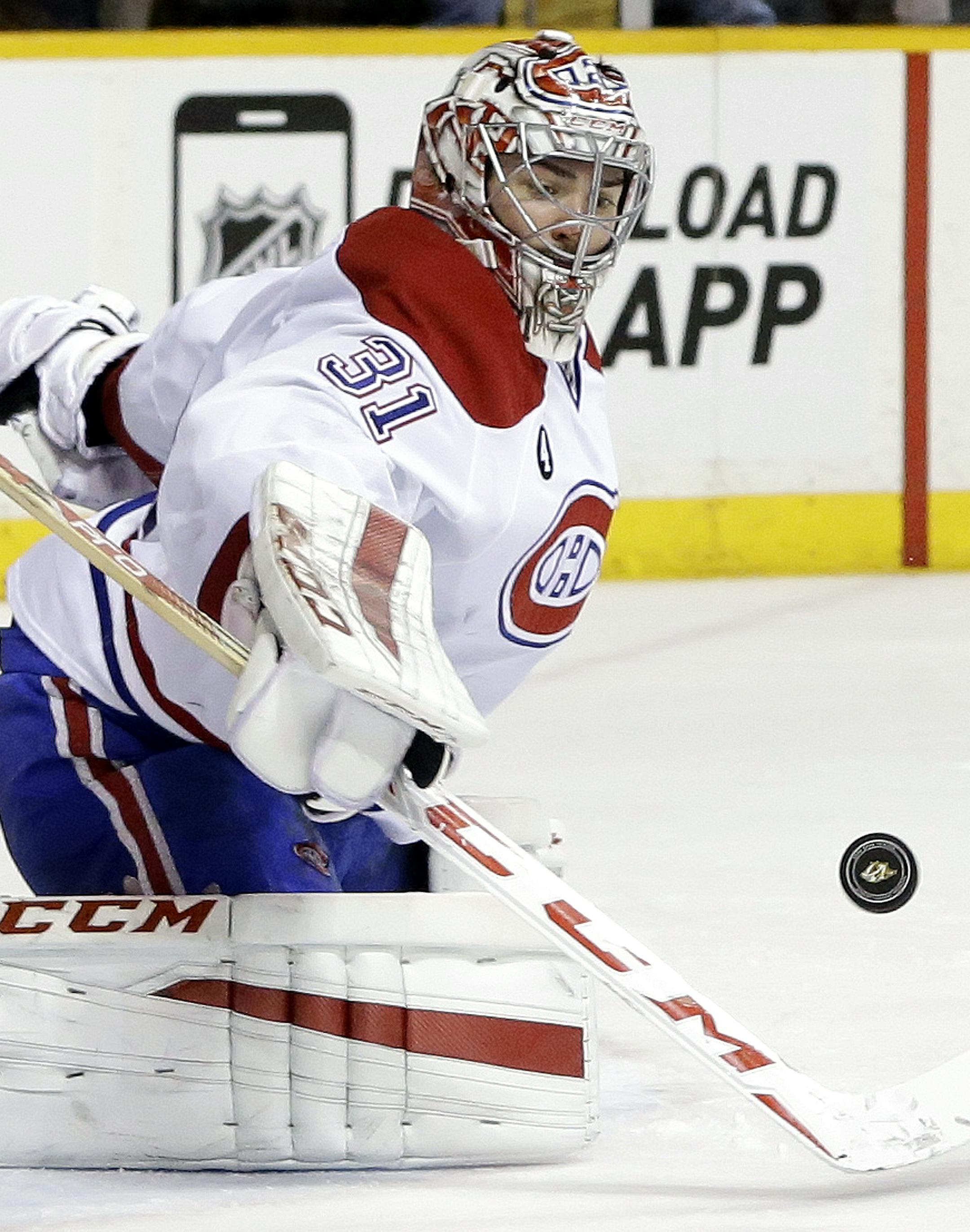 Montreal Canadiens goalie Carey Price blocks a shot against the Nashville Predators in the third period of an NHL hockey game Tuesday, March 24, 2015, in Nashville, Tenn. The Predators won in overtime 3-2. (AP Photo/Mark Humphrey) ORG XMIT: NYOTK