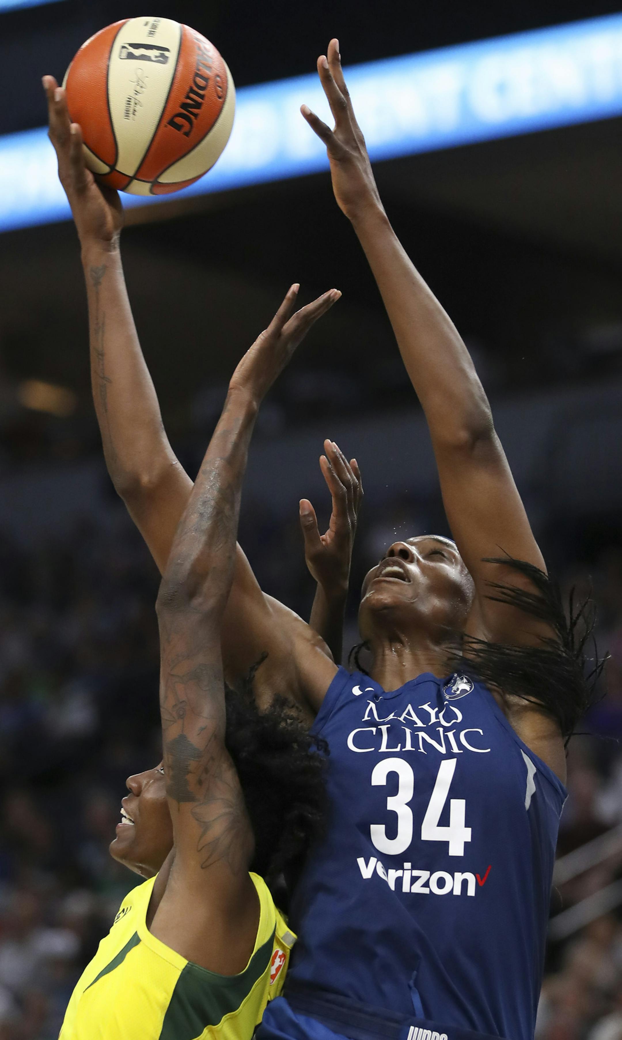 Minnesota Lynx center Sylvia Fowles (34) grabbed a pass above former teammate, Storm forward Natasha Howard in the fourth quarter. ] JEFF WHEELER ï jeff.wheeler@startribune.com The Minnesota Lynx won their fifth straight game with a 91-79 win over the Seattle Storm in an WNBA basketball game Tuesday night, June 26, 2018 at Target Center in Minneapolis.