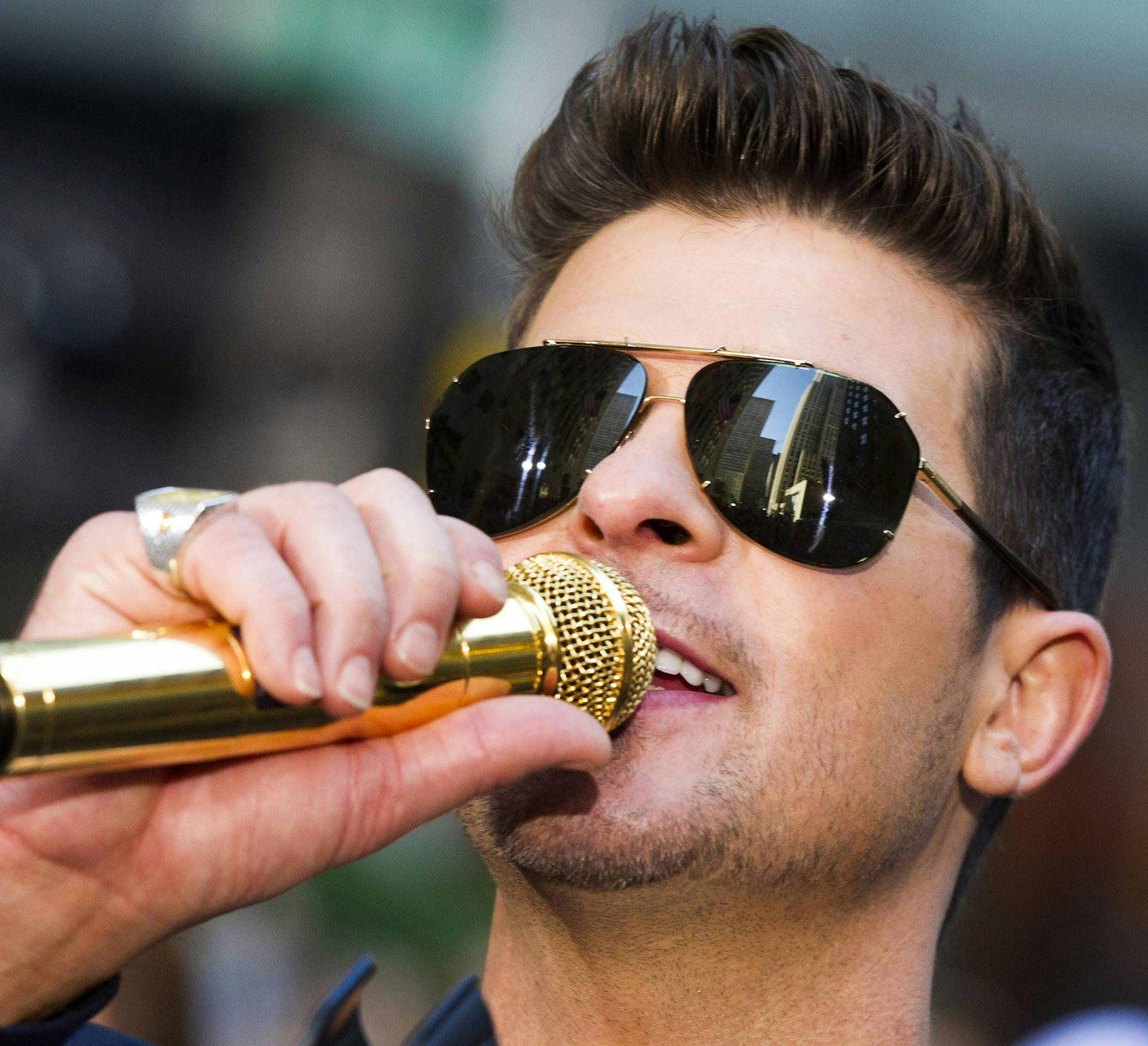 Robin Thicke performs on NBC's "Today" show on Tuesday, July 30, 2013 in New York. (Photo by Charles Sykes/Invision/AP)