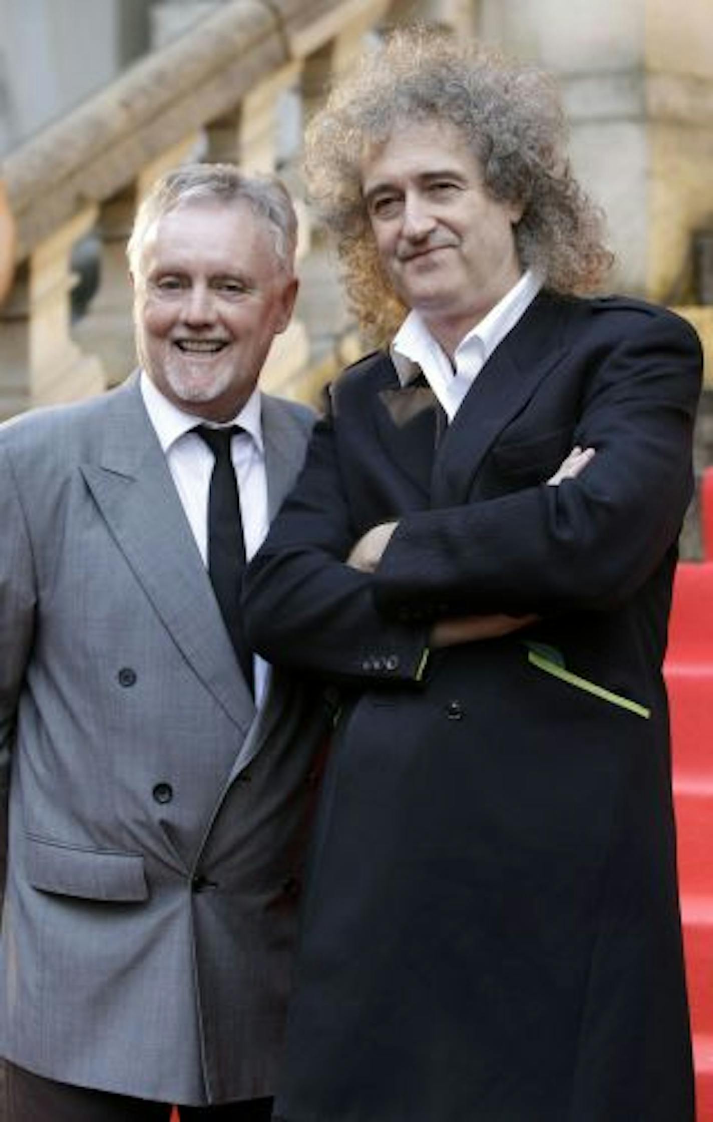 Brian May, right, has a doctorate in astrophysics.