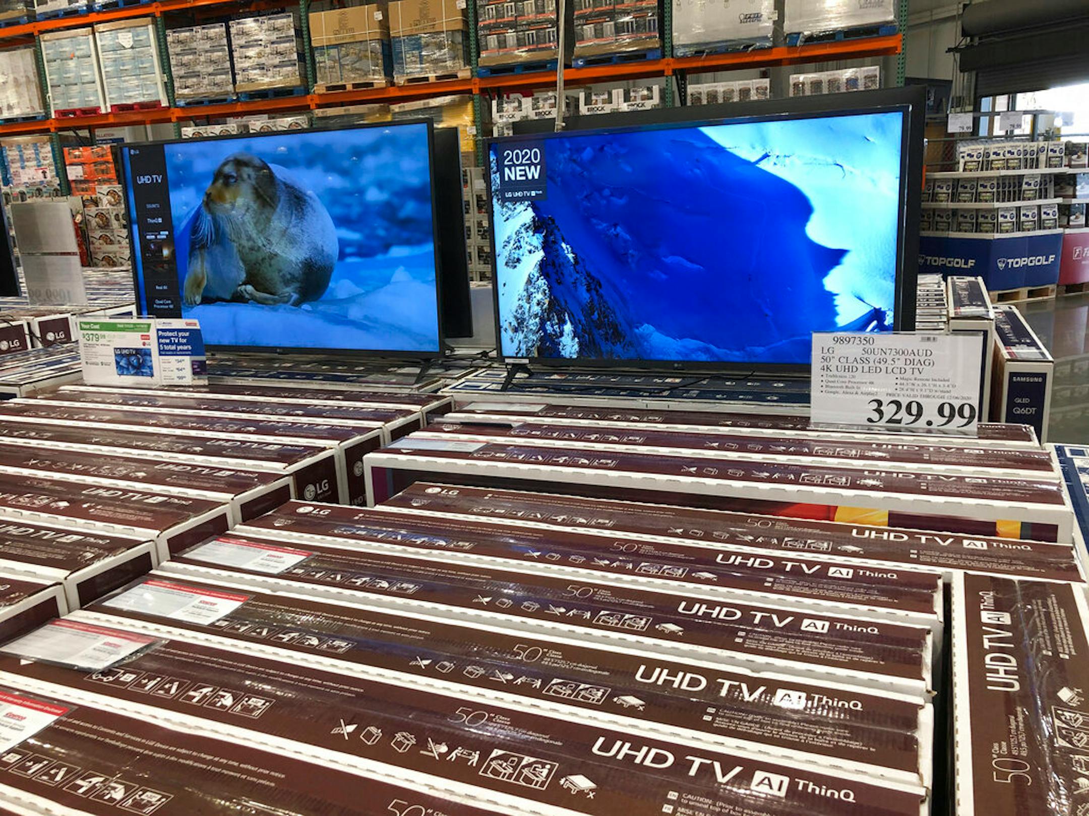 Rows of boxed big-screen televisions sit on display at a Costco warehouse in this photograph taken Wednesday, Nov. 18, 2020, in Sheridan, Colo. Orders for big-ticket manufactured goods slow to modest gain of 1.3% in October indicating economy is slowing.
