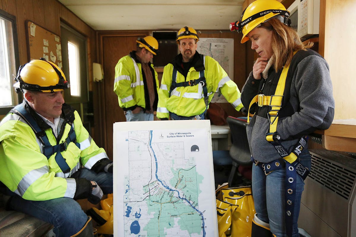 Katrina Kessler, director of Surface Water and Sewers for the Minneapolis Public Works Department, looked over a map of the city's storm sewers before