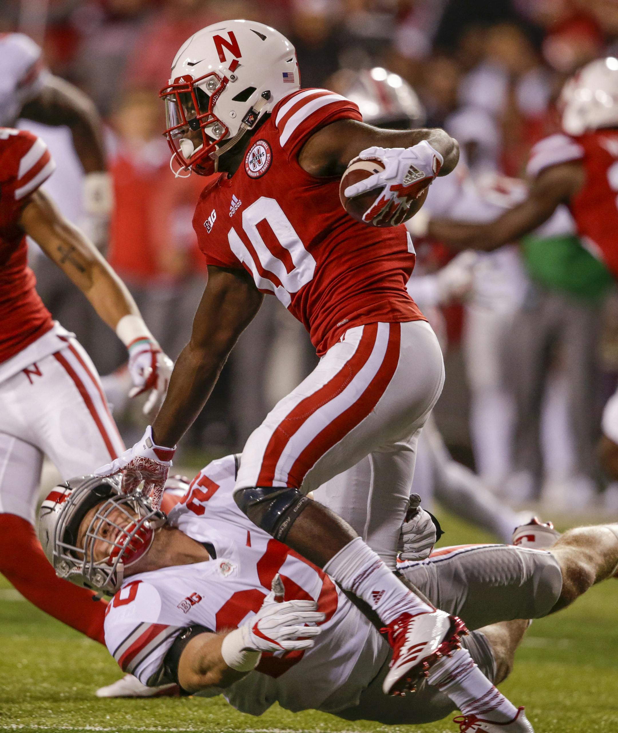 Nebraska wide receiver JD Spielman (10) carries a kickoff return past Ohio State linebacker Pete Werner (20) during the first half of an NCAA college football game in Lincoln, Neb., Saturday, Oct. 14, 2017. (AP Photo/Nati Harnik)